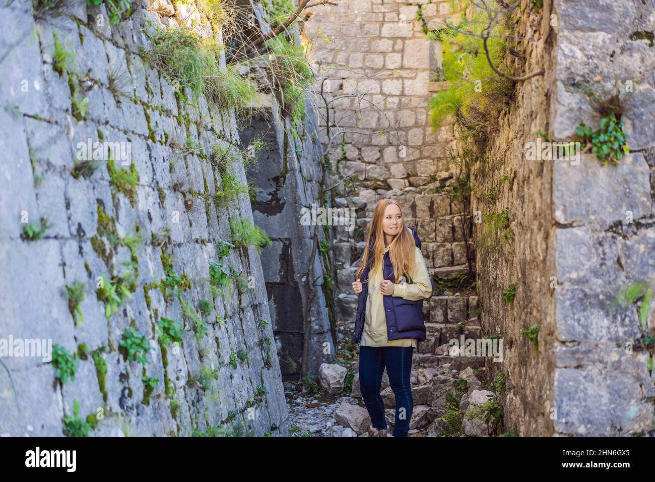 Young tourist woman enjoying a view of Kotor Bay, Montenegro. Kotor Old ...