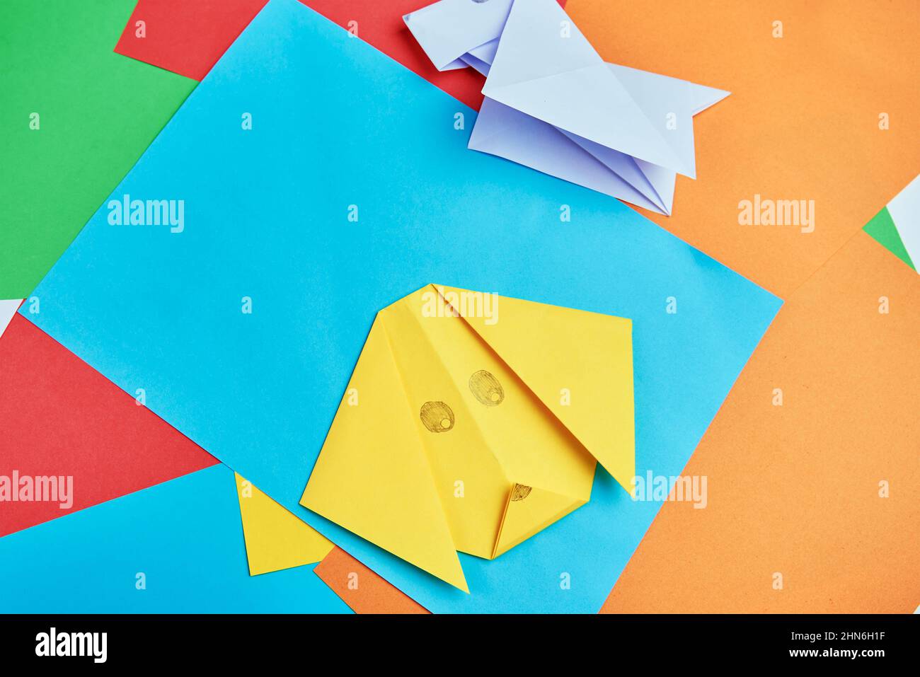 Origami dog with colorful paper sheets, Child creative education Stock Photo