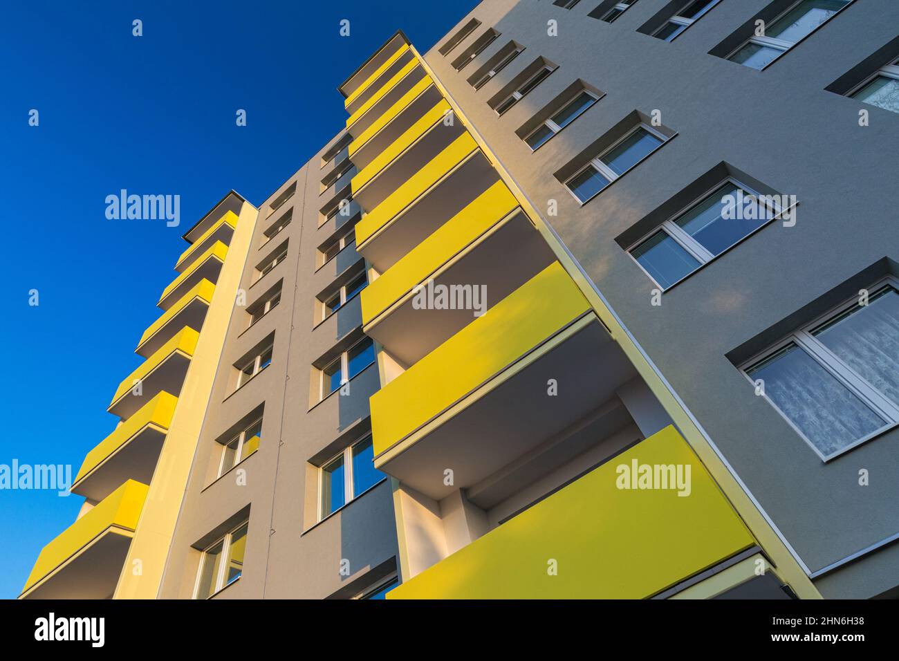 Facade of a renovated apartment block of flats with balconies. Stock Photo