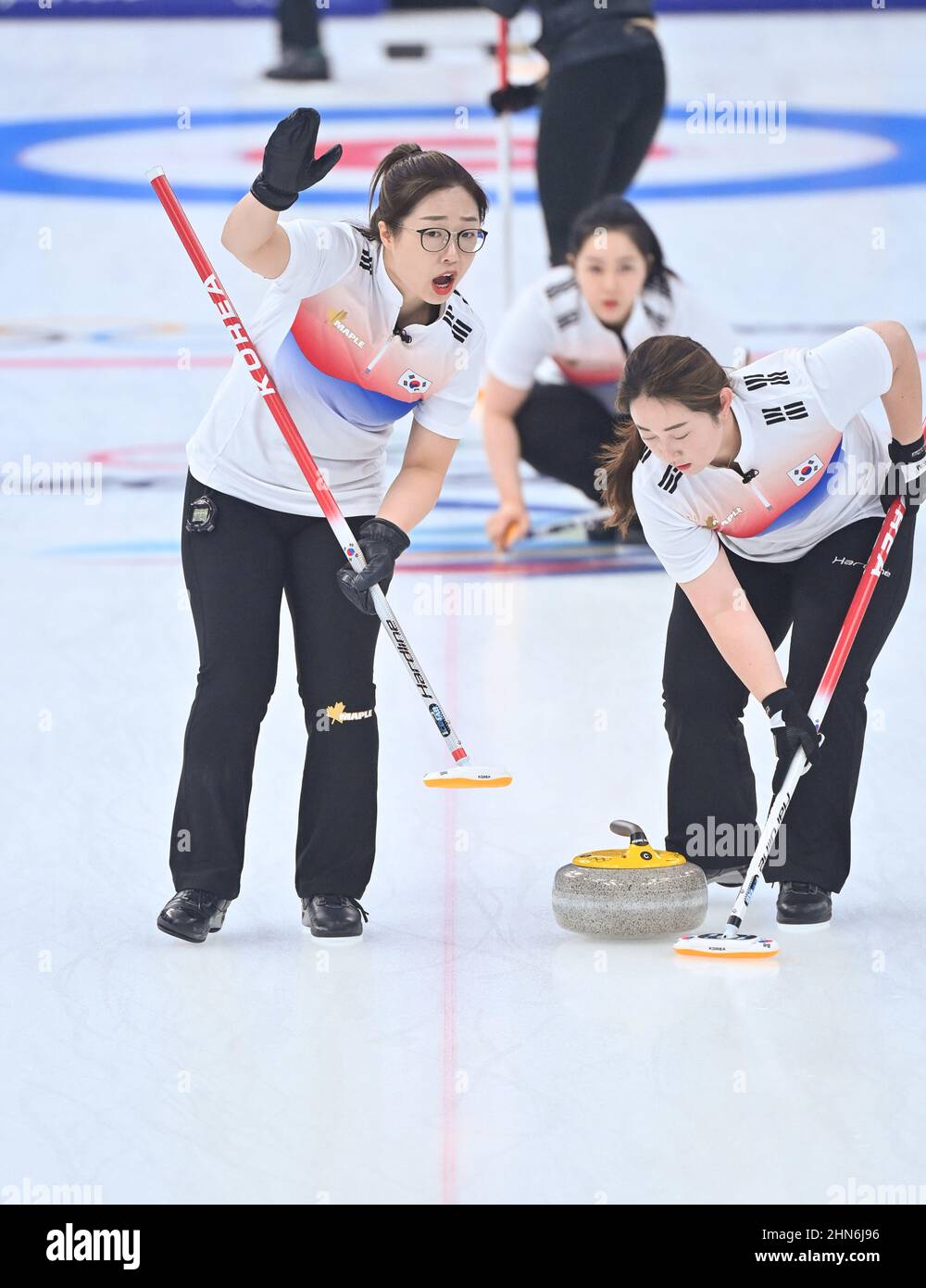 Beijing, China. 14th Feb, 2022. Kim SeonYeong (L) competes during the Curling Women's Round Robin Session 8 of the Beijing 2022 Winter Olympics between Japan and South Korea at the National Aquatics Centre in Beijing, capital of China, Feb. 14, 2022. Credit: Huang Xiaobang/Xinhua/Alamy Live News Stock Photo