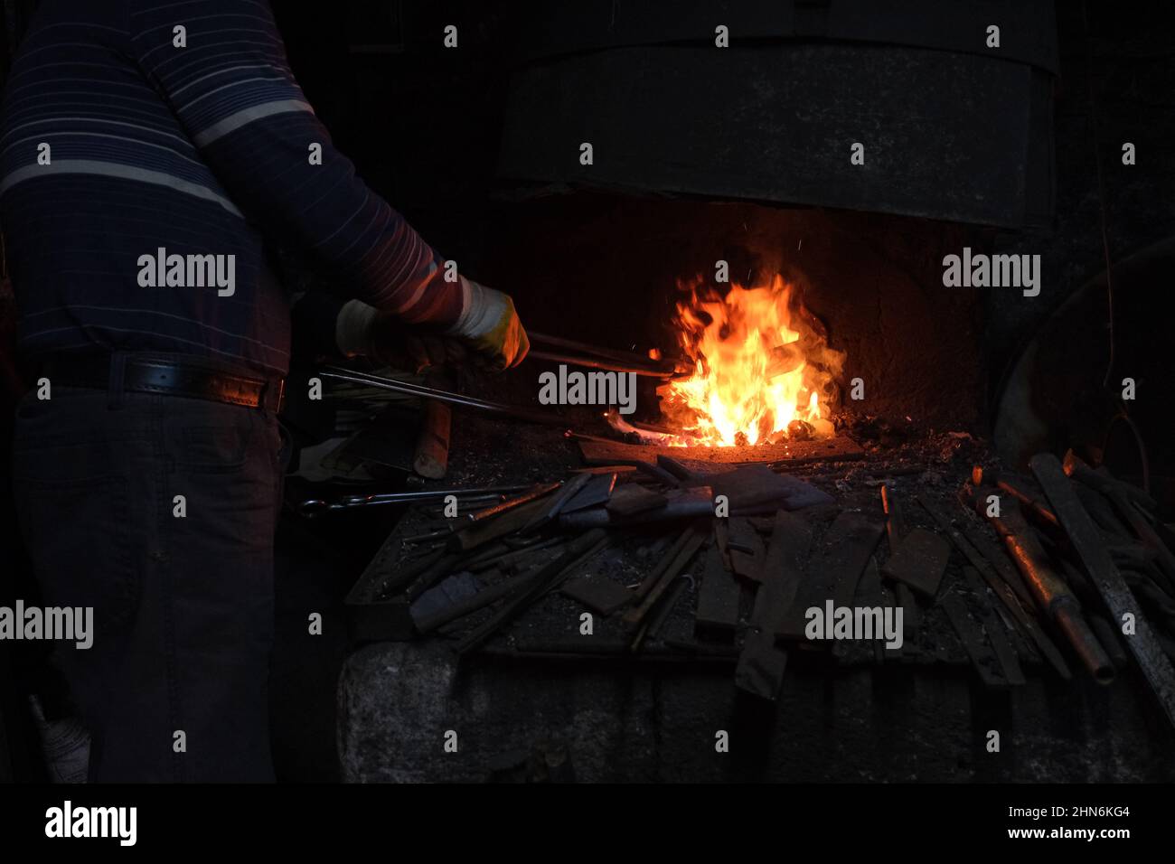 Blacksmiths and fire, hand made metal working of forging at fire. Stock Photo