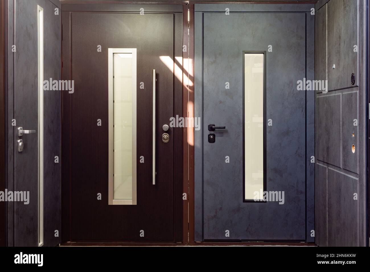 Entrance doors for sale in a specialized store. Buyers prefer metal