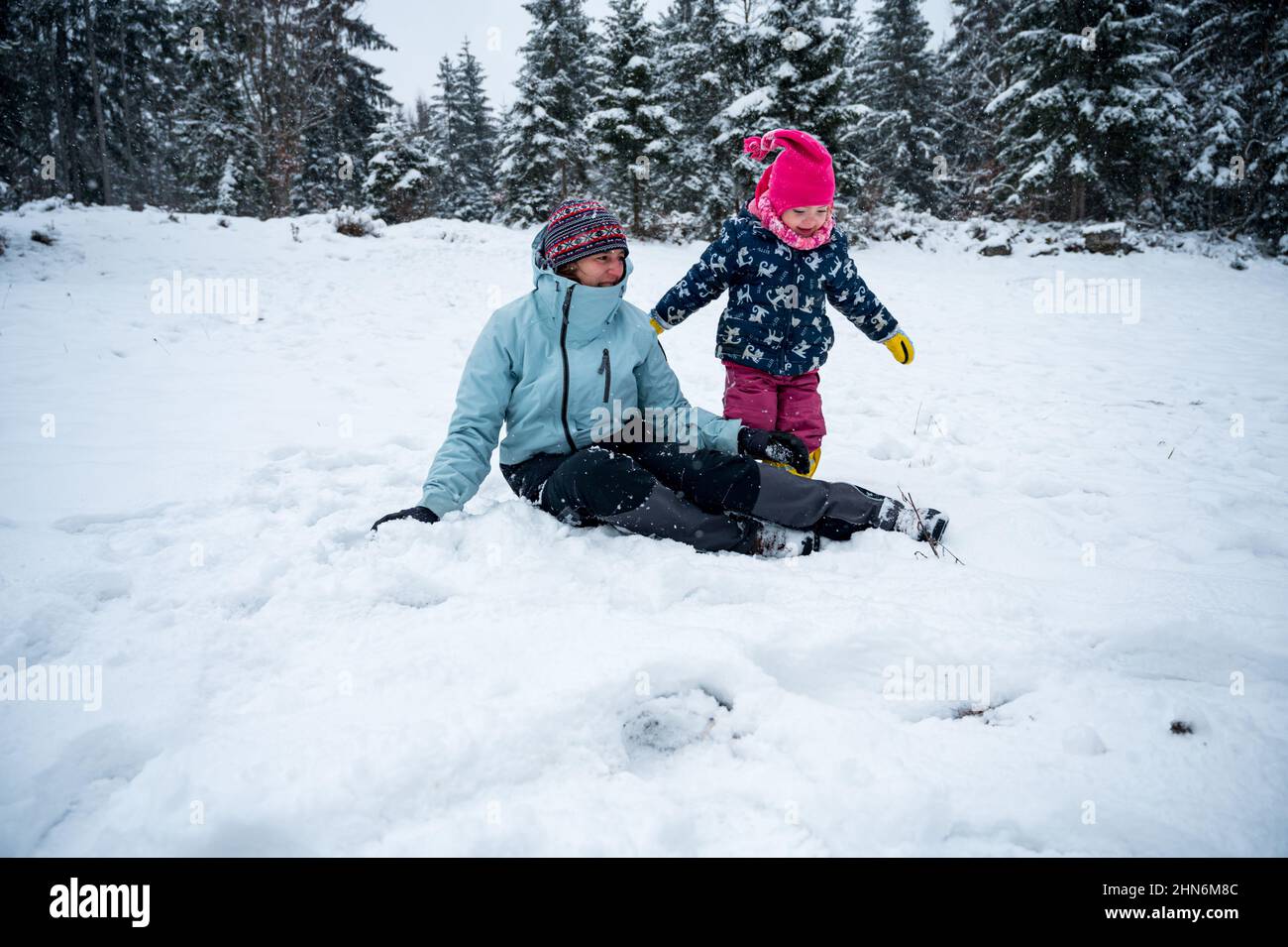 Fun In The Snow Mother and daughter having fun in the snow Stock Photo - Alamy