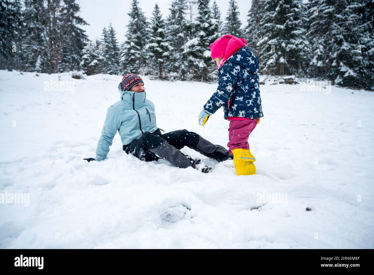 Fun In The Snow Mother and daughter having fun in the snow Stock Photo - Alamy