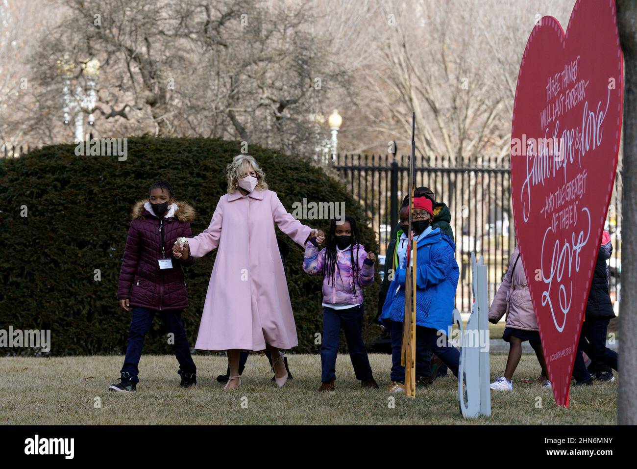 U.S. First lady Jill Biden walks with second graders from a DC