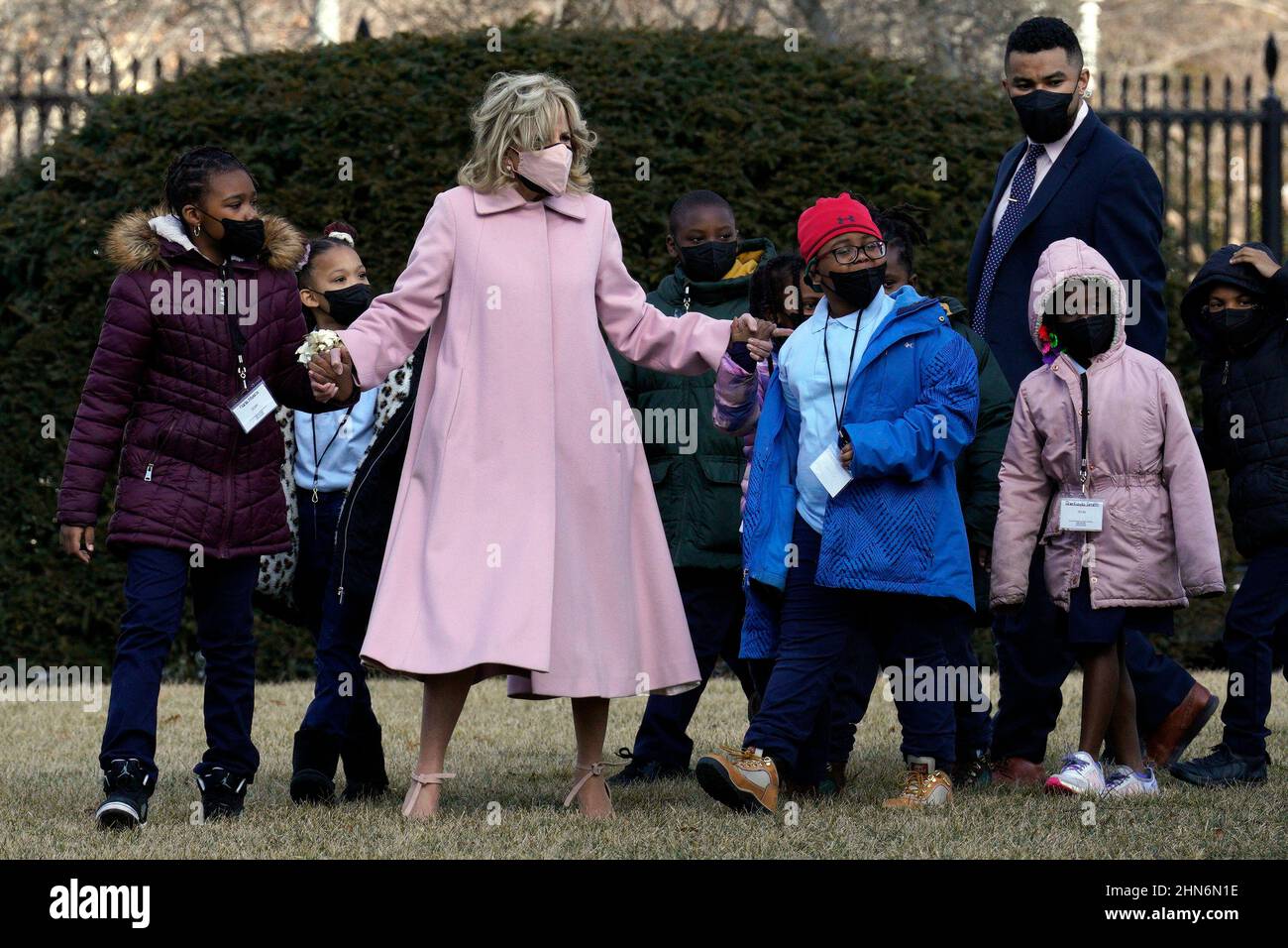 U.S. First lady Jill Biden walks with second graders from a DC