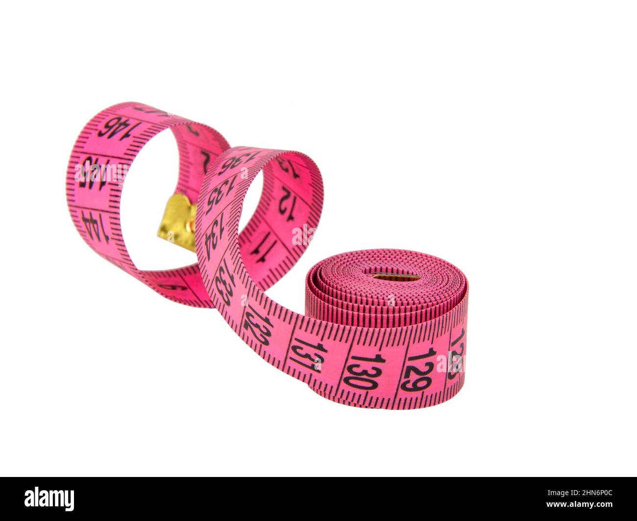 Pink tape measure roll isolated on the white background Stock Photo - Alamy