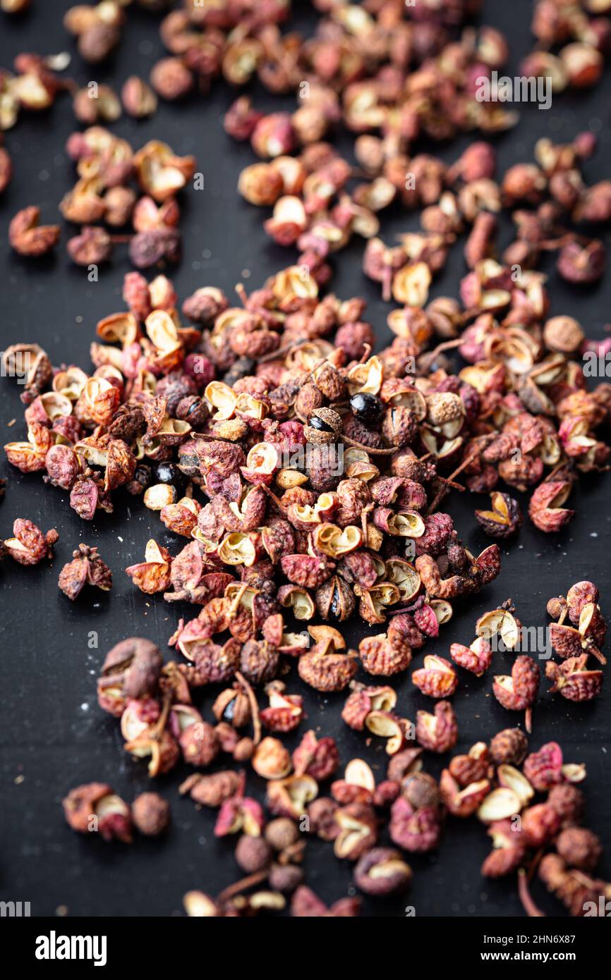 sichuan peppercorns on black background Stock Photo