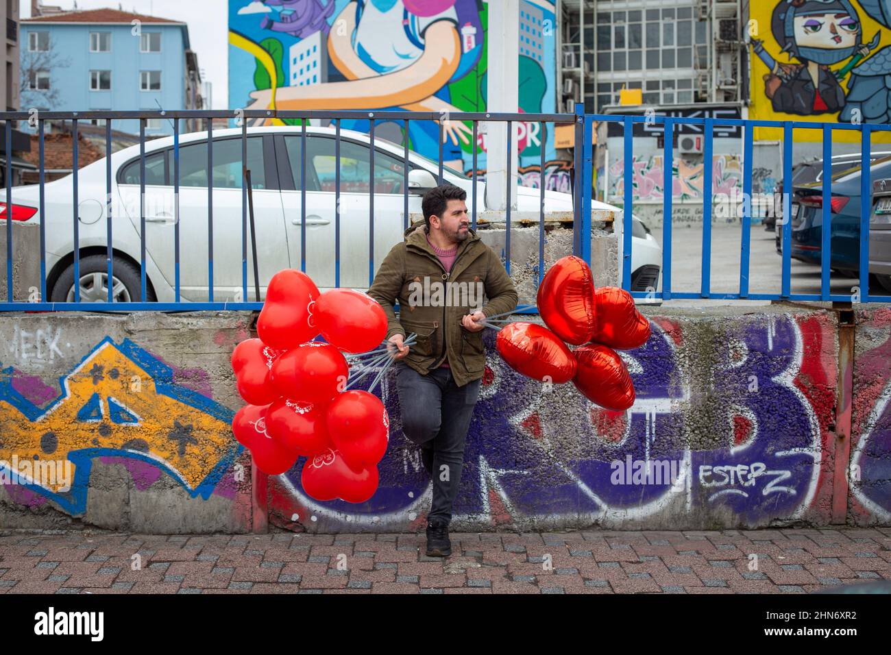 February 14, 2022: A peddler of balloons sells balloons for Valentine's Day  in Kadikoy. Turkey's economic woes have impacted flower and gift sales  ahead of Valentine's Day, as consumers have been forced