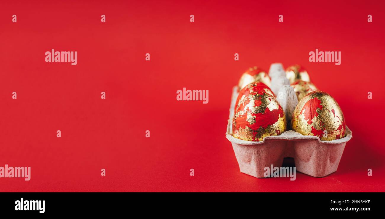 Red painted Easter eggs on red background Stock Photo