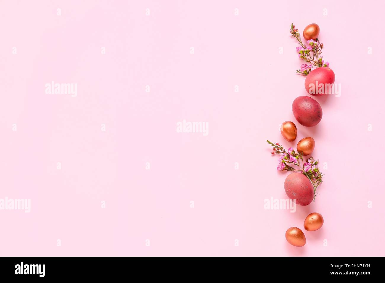 Composition with Easter eggs and flowers on pink background Stock Photo ...