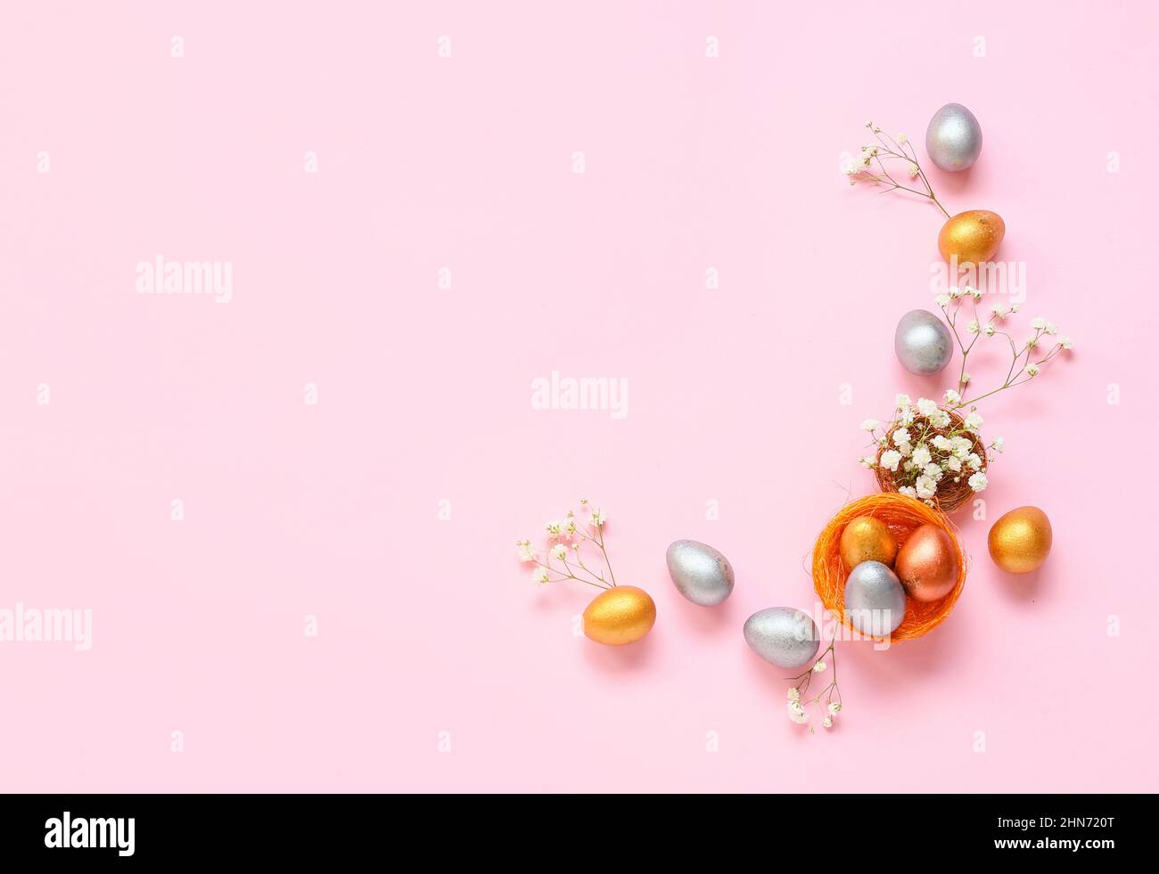 Composition with Easter eggs and flowers on pink background Stock Photo ...