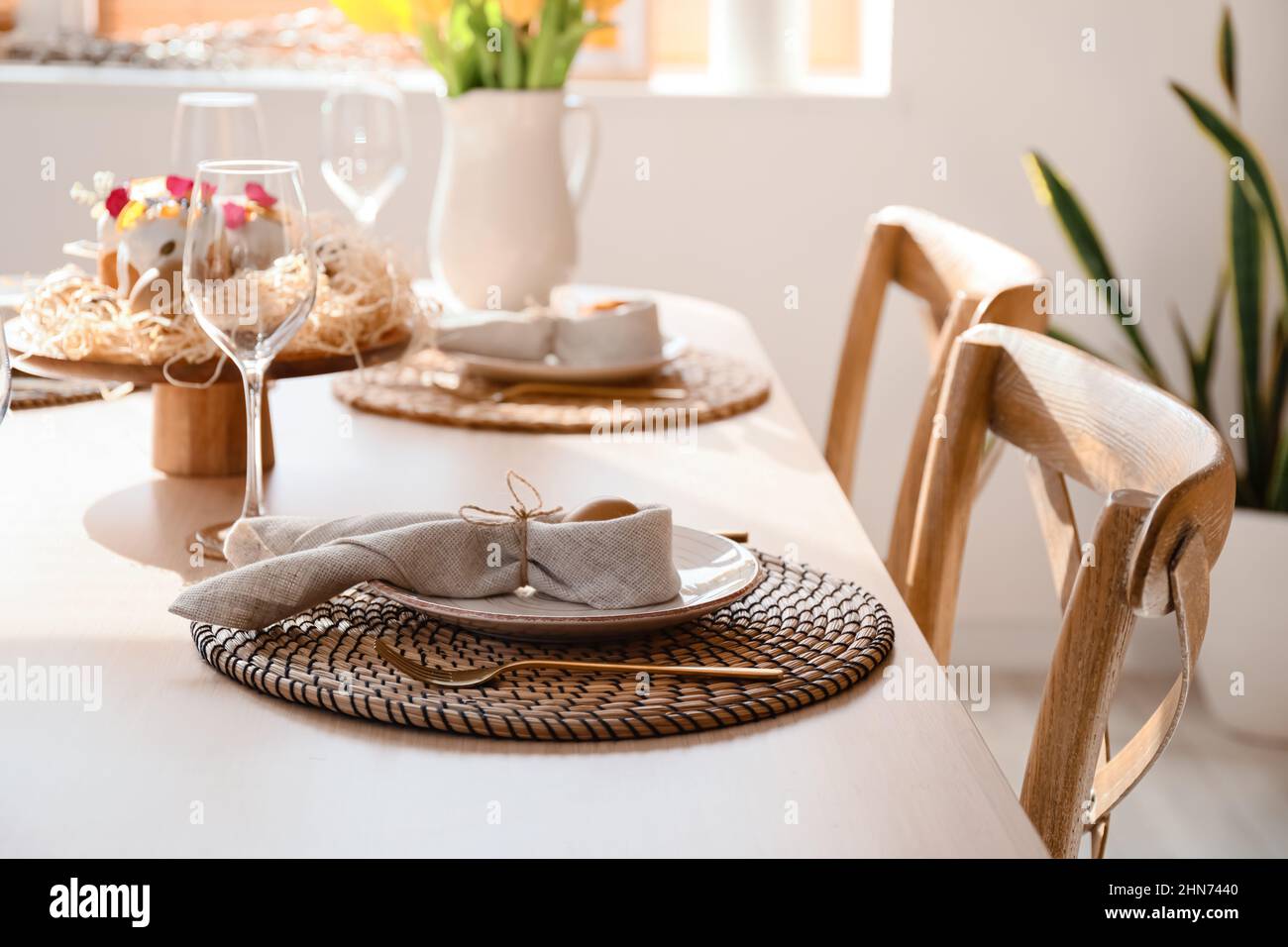 Festive dinnerware on table served for Easter celebration Stock Photo