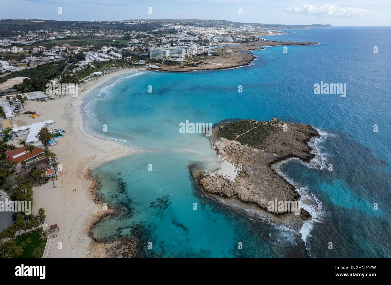 Aerial drone view of the coastline of empty beach in winter. Summer holidays. Nissi beach Ayia Napa, Cyprus Stock Photo