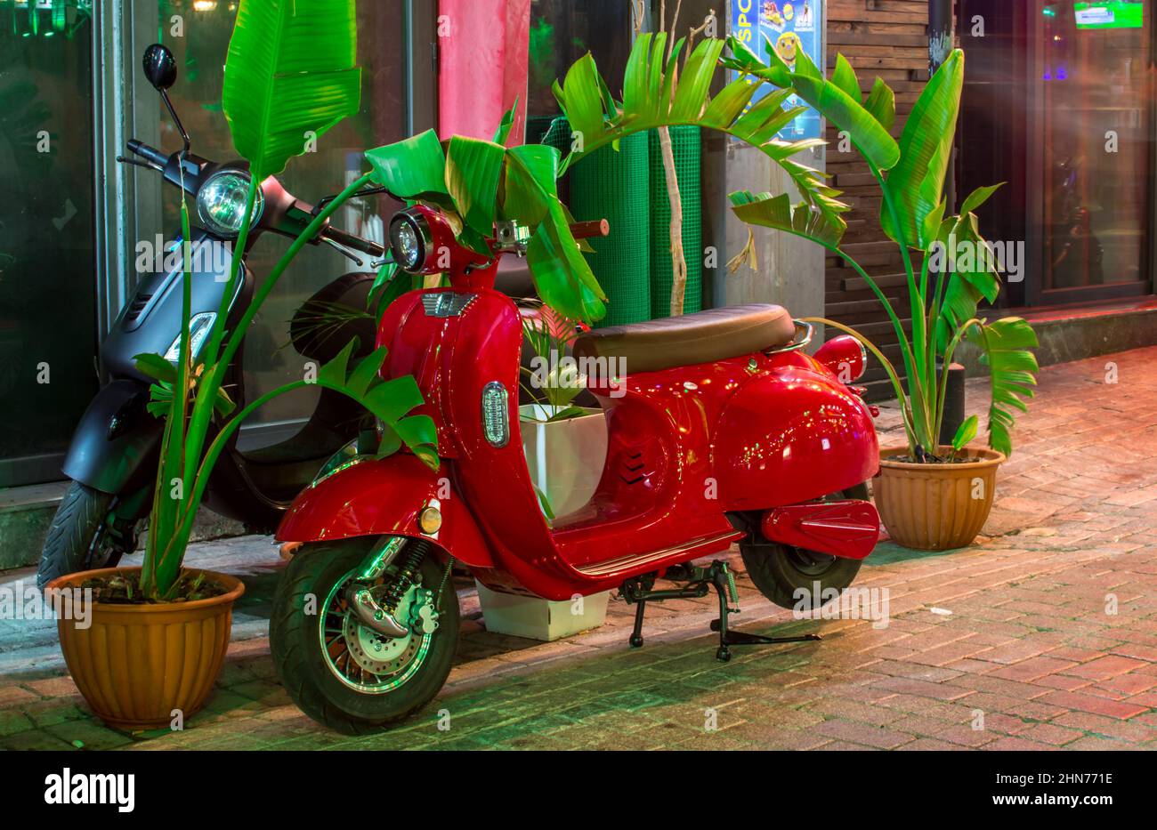 red scooter parked on road Stock Photo Alamy