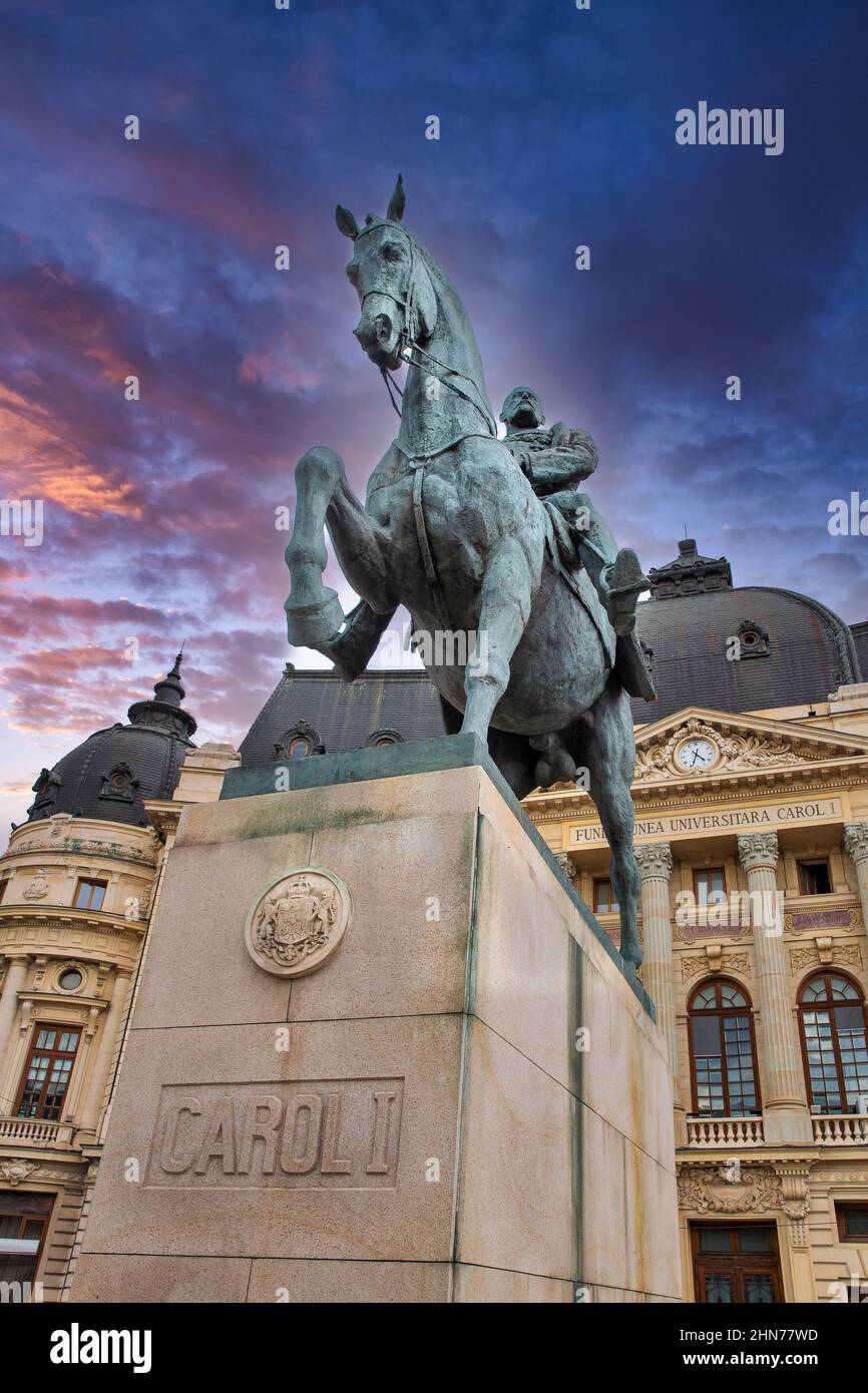Dramatic sunset sky and equestrian statue of Carol I in front of ...