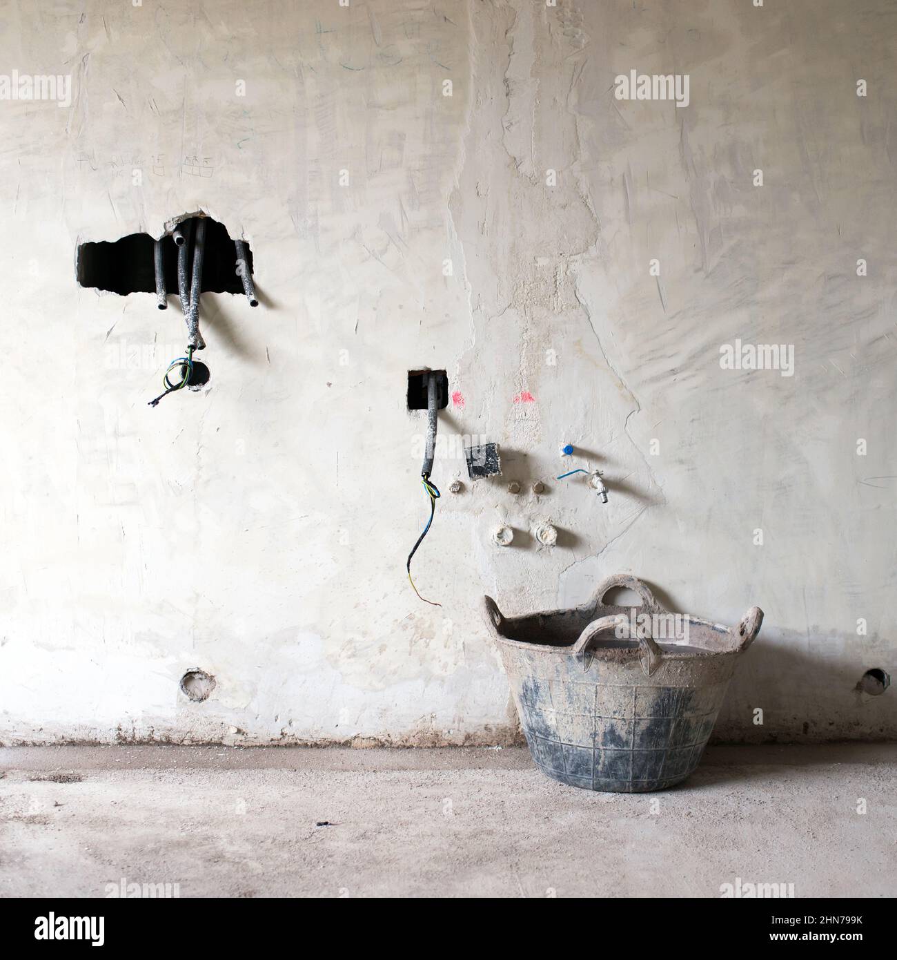 House construction or renovation. Raw walls with holes for wires