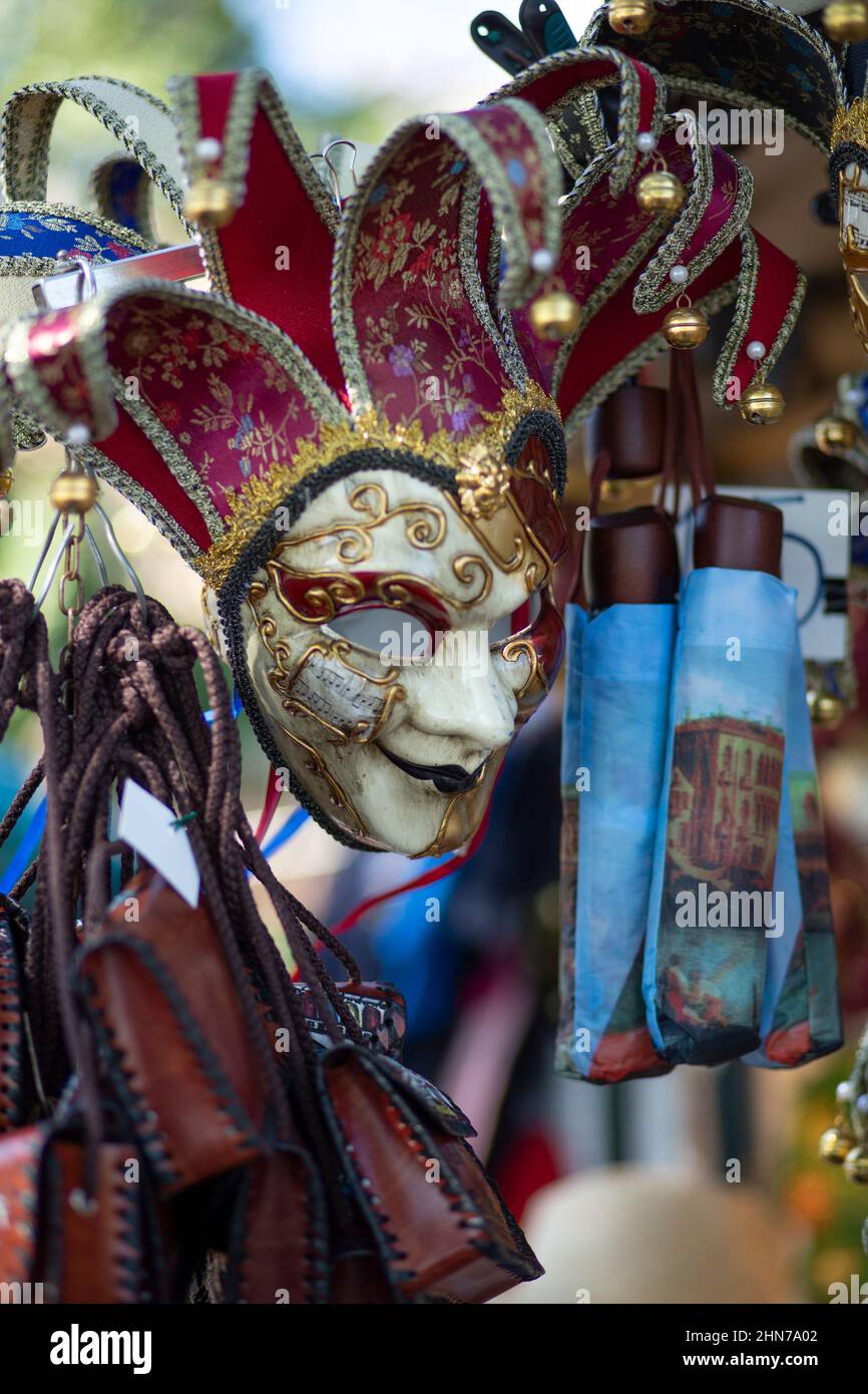 street stalls in st marks square selling venation masks and t,shirts and hats aimed at the many tourists that flock to Venice every year Stock Photo