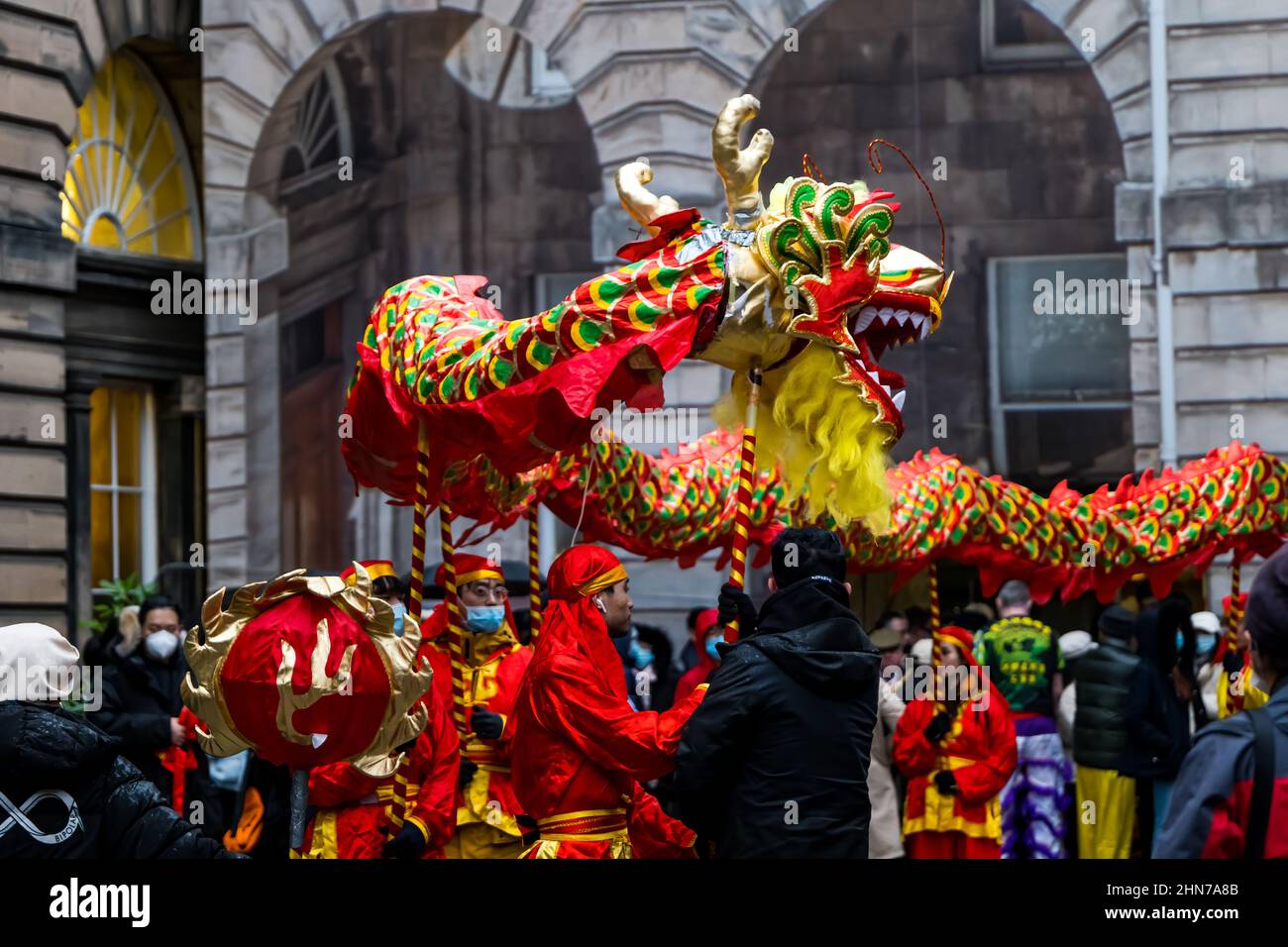 Chinese New Year celebration with performers carrying a dragon, City