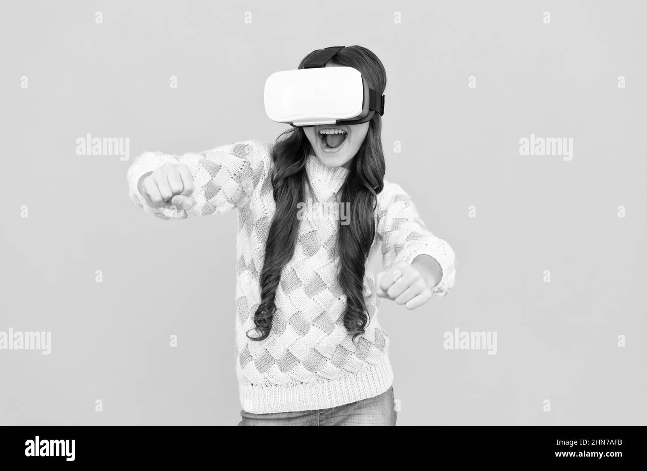 happy teen girl wear wireless VR glasses. using VR headset. kid play video game. Digital future Stock Photo
