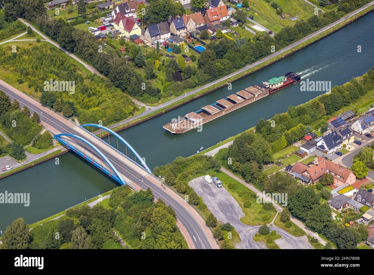 Aerial view, cargo ship on the Datteln-Hamm canal at the Werner Straße bridge in Rünthe, Bergkamen, Ruhr area, North Rhine-Westphalia, Germany, inland Stock Photo