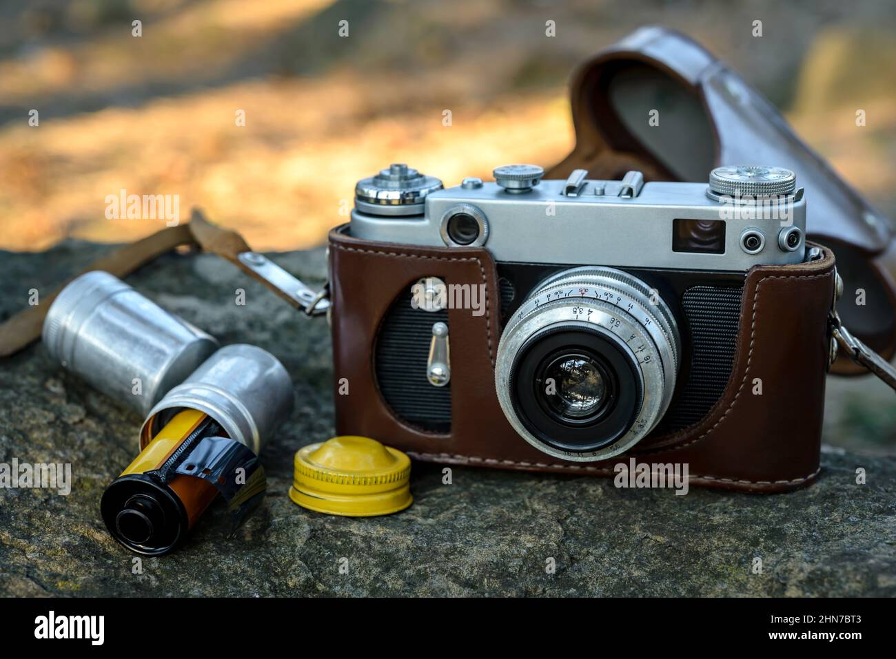 photo film in cartridge on old background Stock Photo - Alamy