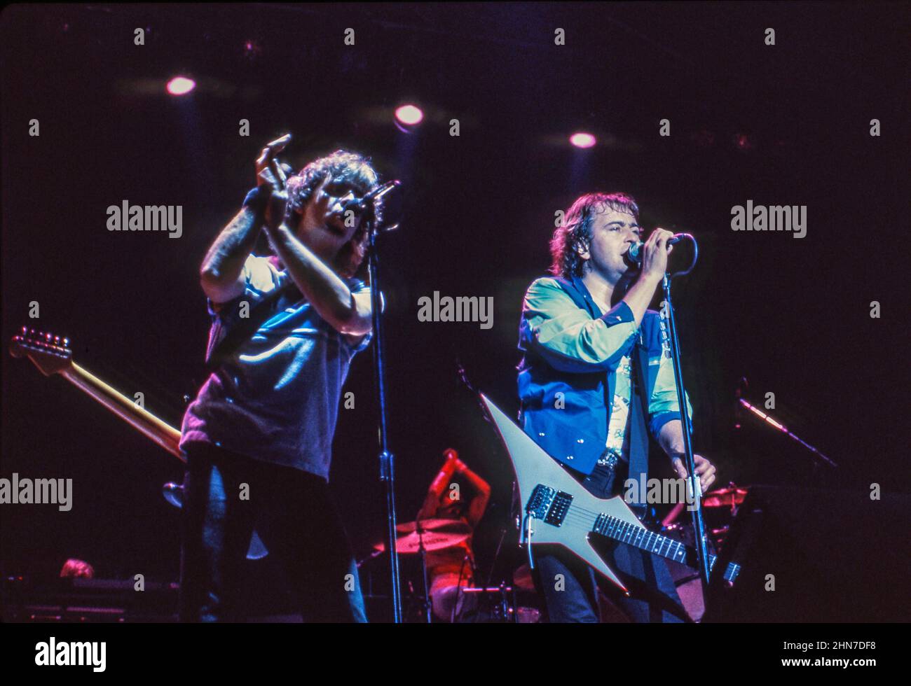 Bob Mayo and Mick Jones of Anglo-American band Foreigner performing at Wembley Arena, London in 1985. Stock Photo