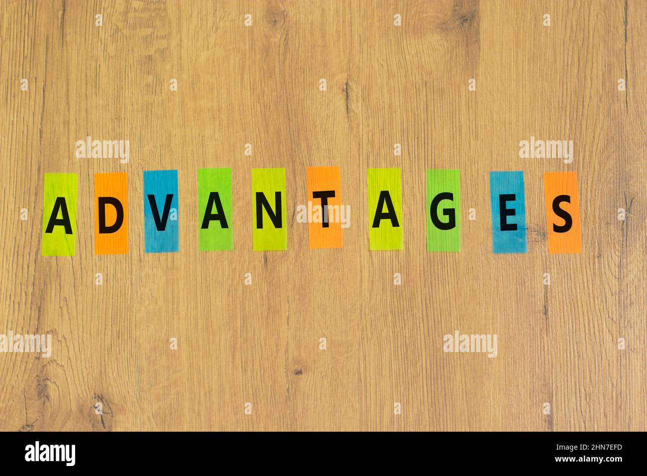 Advantages symbol. The concept word Advantages on colored papers on a beautiful wooden background. Business and advantages concept, copy space. Stock Photo