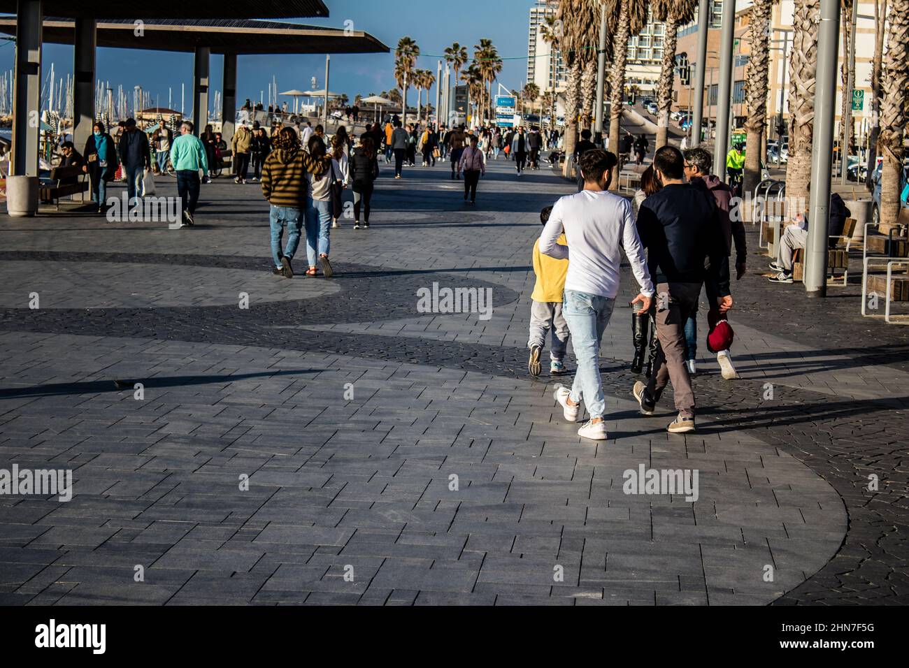 Tel Aviv, Israel - February 13, 2022 Unidentified people walking on Tel  Aviv Promenade, commonly referred to in Hebrew simply as the Tayelet, runs  alo Stock Photo - Alamy