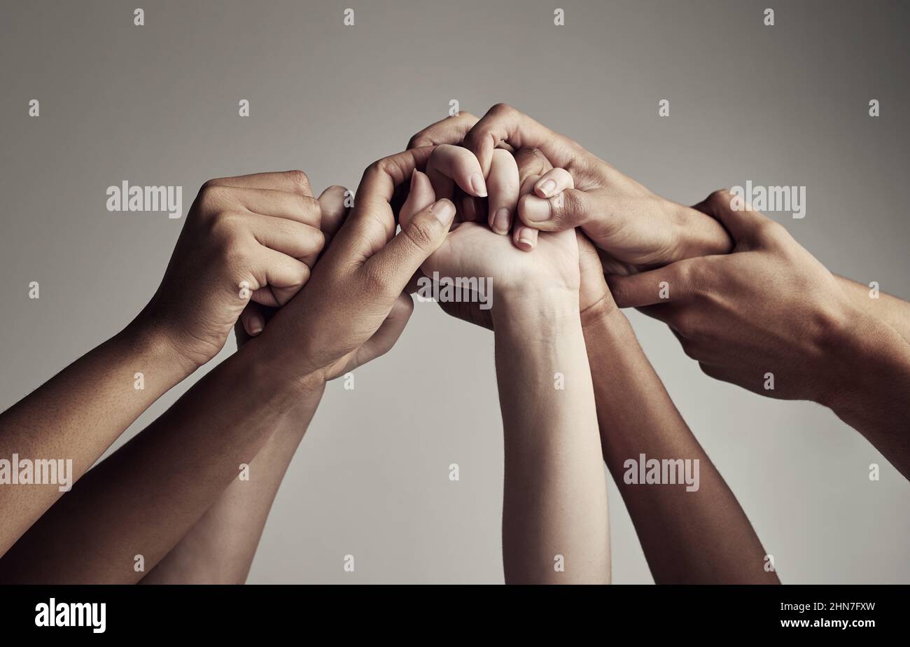 As a team. Cropped shot of unrecognizable businesspeople coming together as a team. Stock Photo