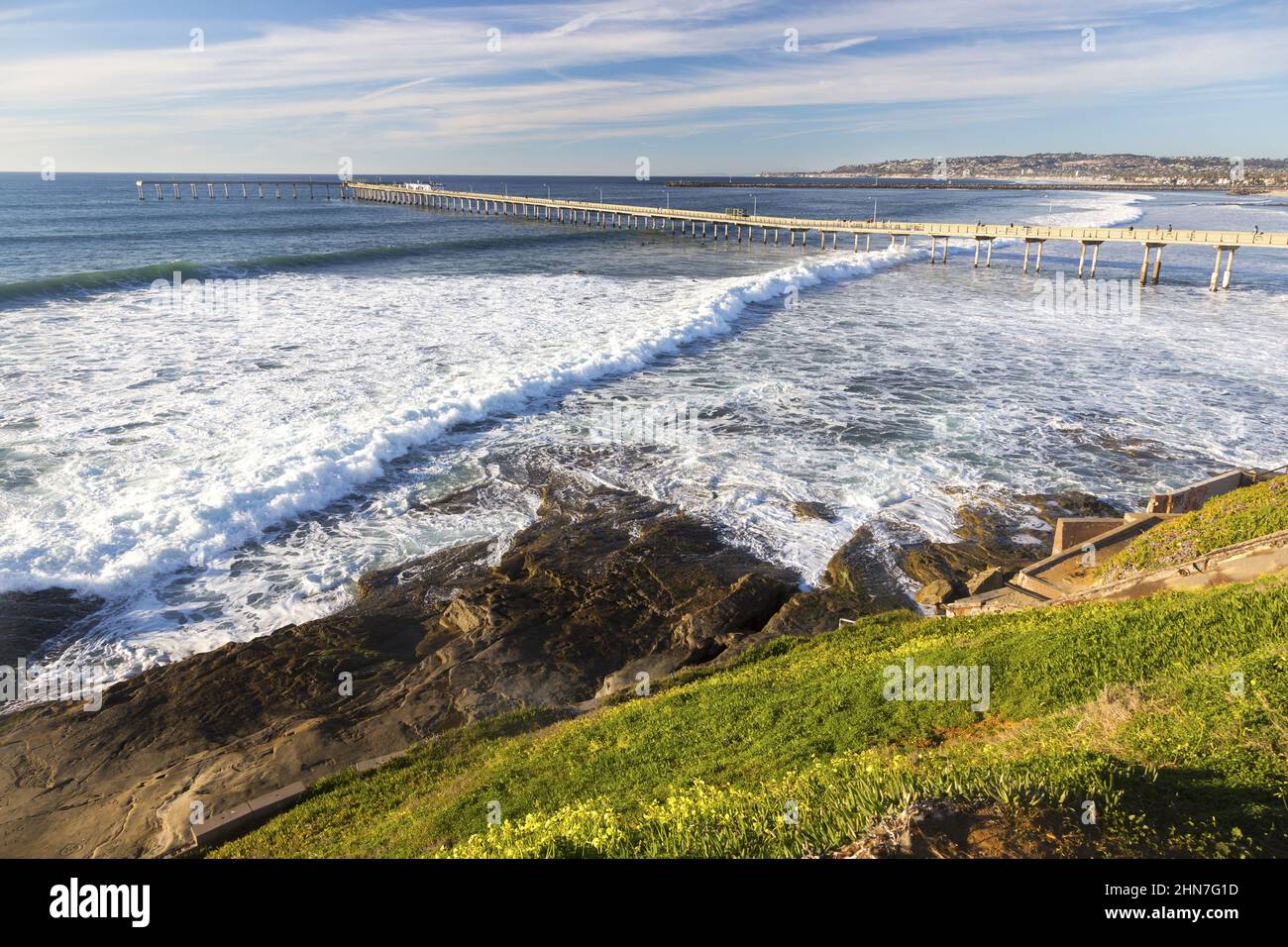 Ocean Beach Pier Breaking Tide Waves Aerial View and Southern California Pacific Coastline. Scenic San Diego Seascape on a Clear Sunny Winter Day Stock Photo