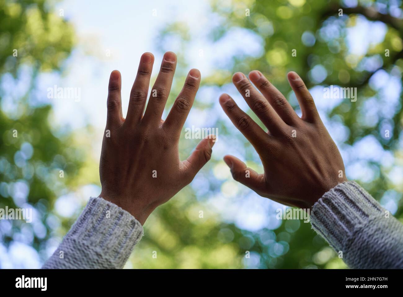 Man hands raised to the sky hi-res stock photography and images - Alamy