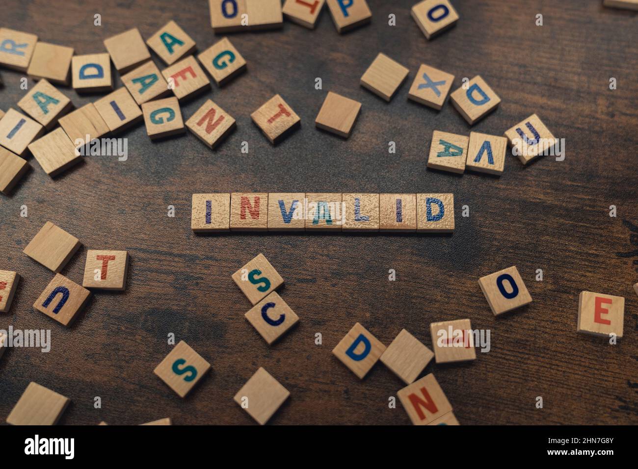 Invalid word made of scattered wooden alphabet letters - concept. High quality photo Stock Photo