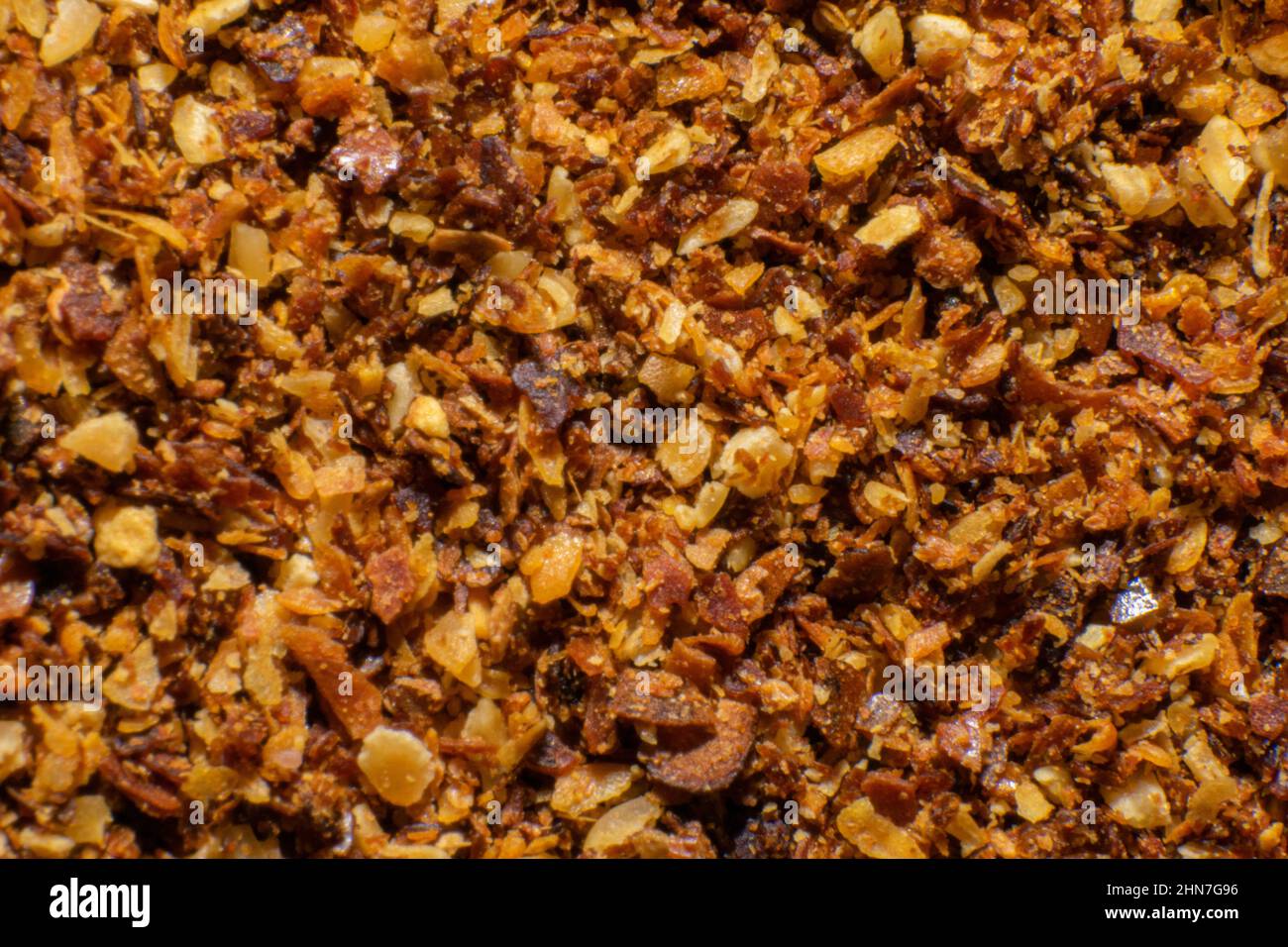 Food condiments close-up photography, flavors of cultural food. Cooking with flavor. Crushed red pepper close-up. Spicy food condiments. Stock Photo