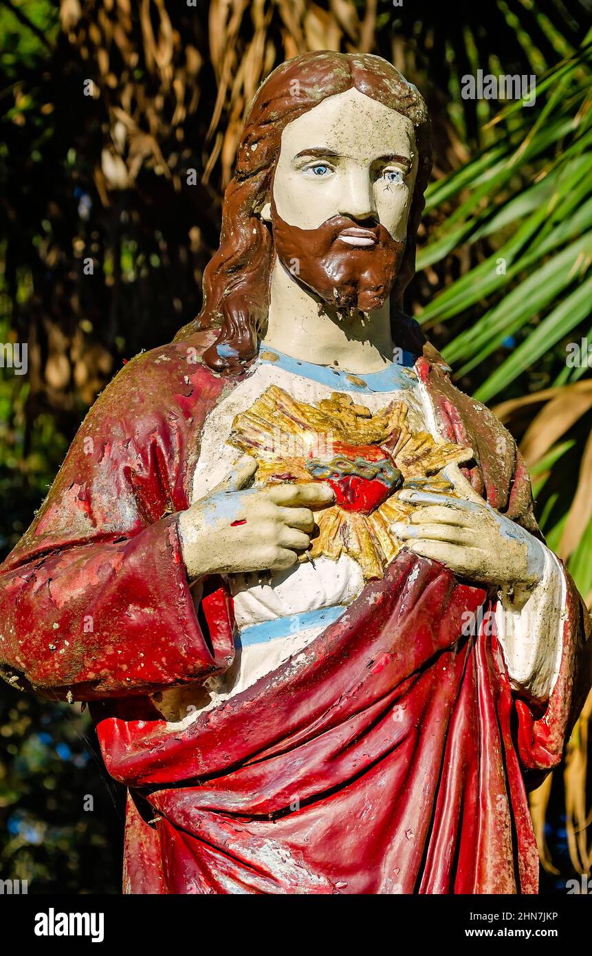 A Sacred Heart of Jesus statue stands in Dauphin Island Cemetery, Feb. 9, 2022, in Dauphin Island, Alabama. Stock Photo