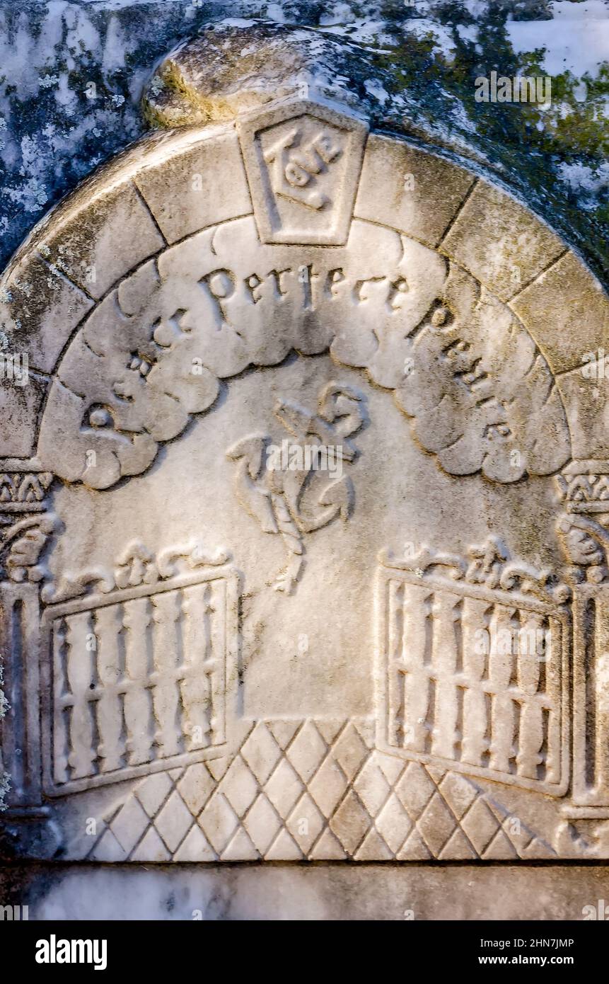 A tombstone features an image of Heaven’s gates and the inscription, “Peace Perfect Peace,” at Dauphin Island Cemetery, in Dauphin Island, Alabama. Stock Photo