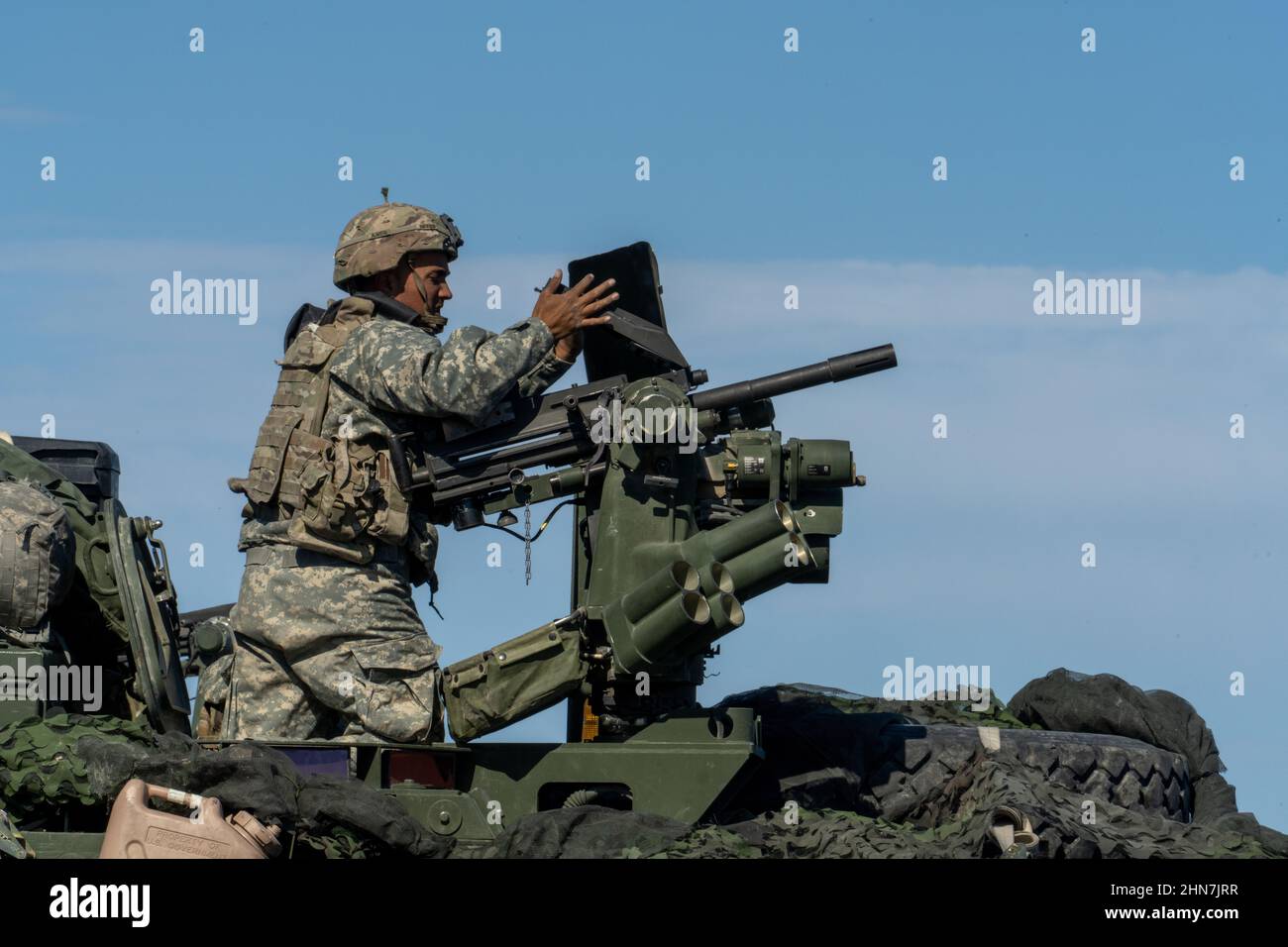 A U.S. Army Trooper assigned to 3d Cavalry Regiment reloads a MK19 Automatic Grenade Launcher during exercise Rifles Forge at Fort Hood Training Area, Fort Hood, Texas, Feb. 10, 2022. This exercise will prepare the unit to travel to the National Training Center at Fort Irwin, California, to certify the unit to deploy in a combat environment. (U.S. Army photo by Staff Sgt. Christopher Stewart) Stock Photo