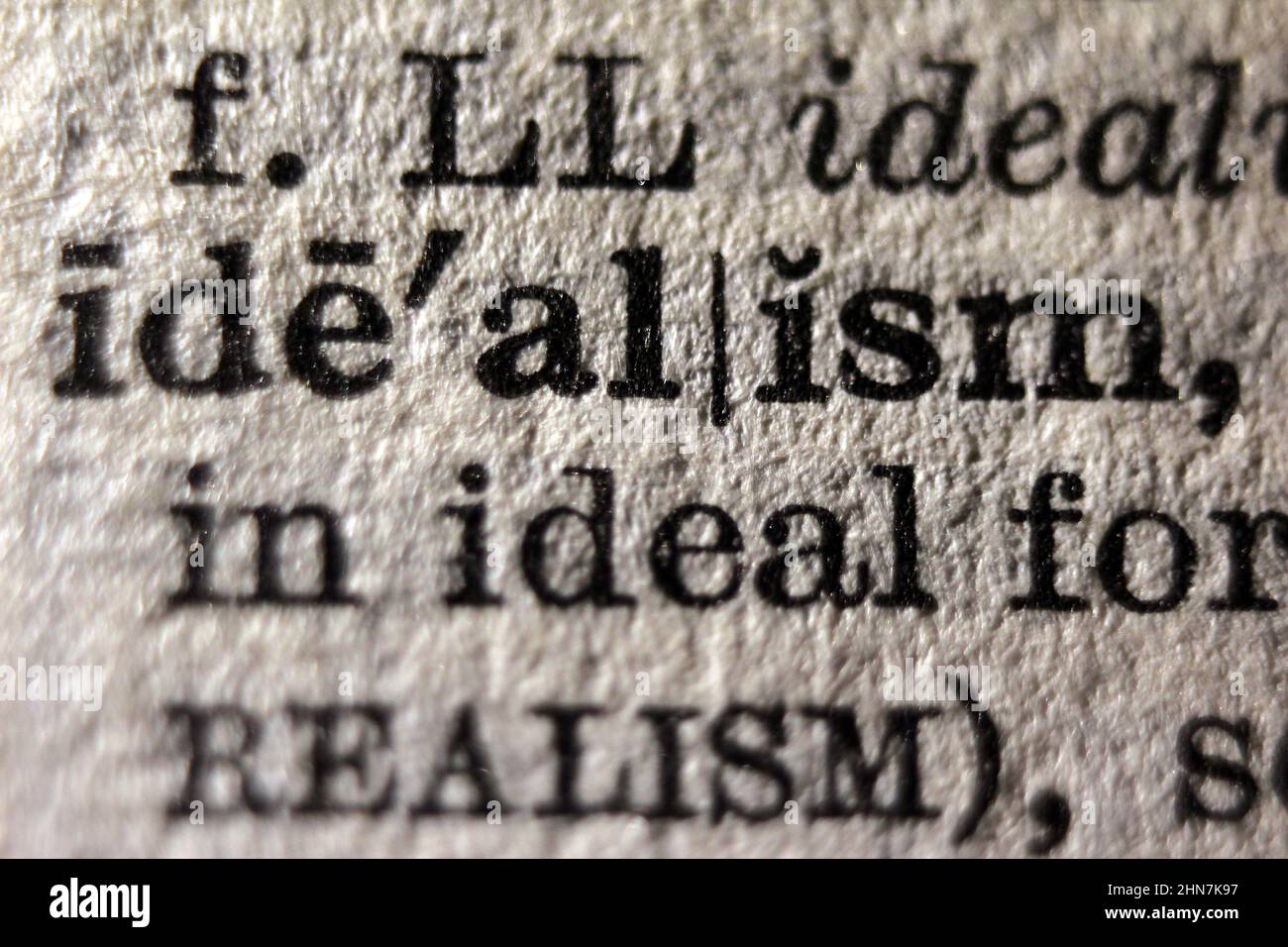 Definition of word idealism on dictionary page, close-up Stock Photo
