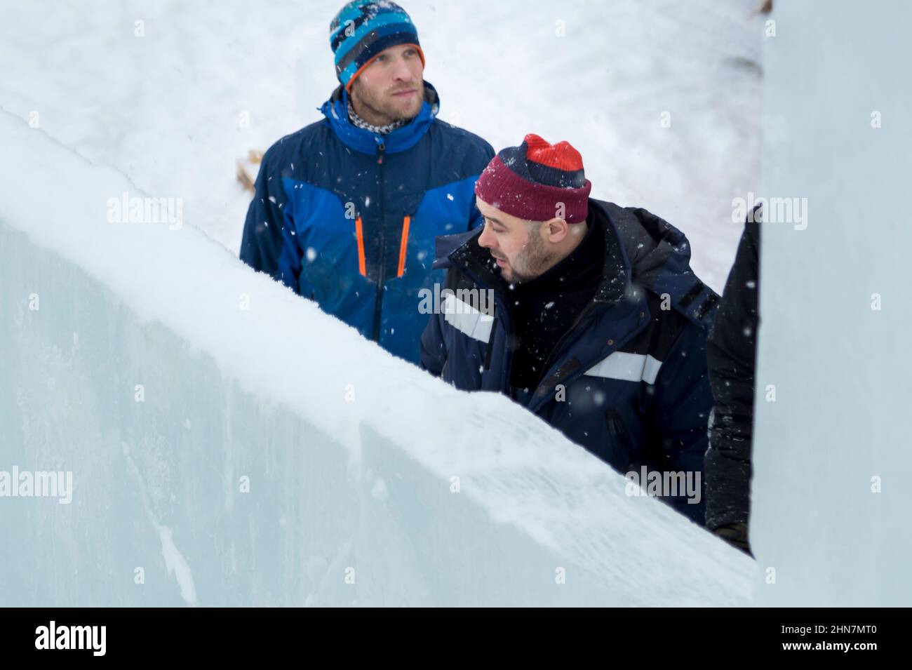 Installers at the construction site are talking Stock Photo