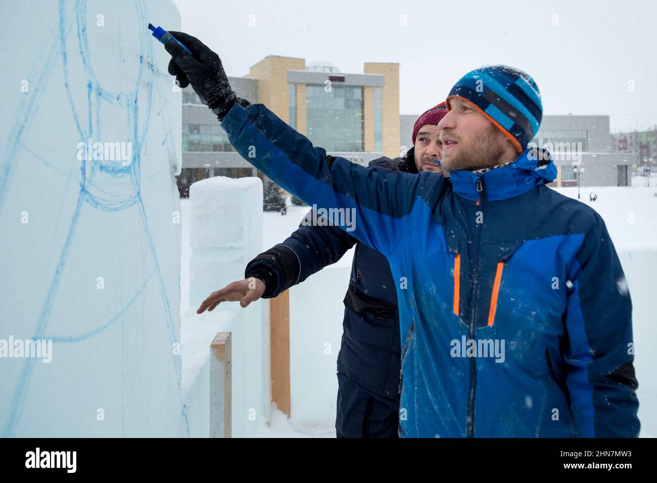Installers at the construction site are talking Stock Photo