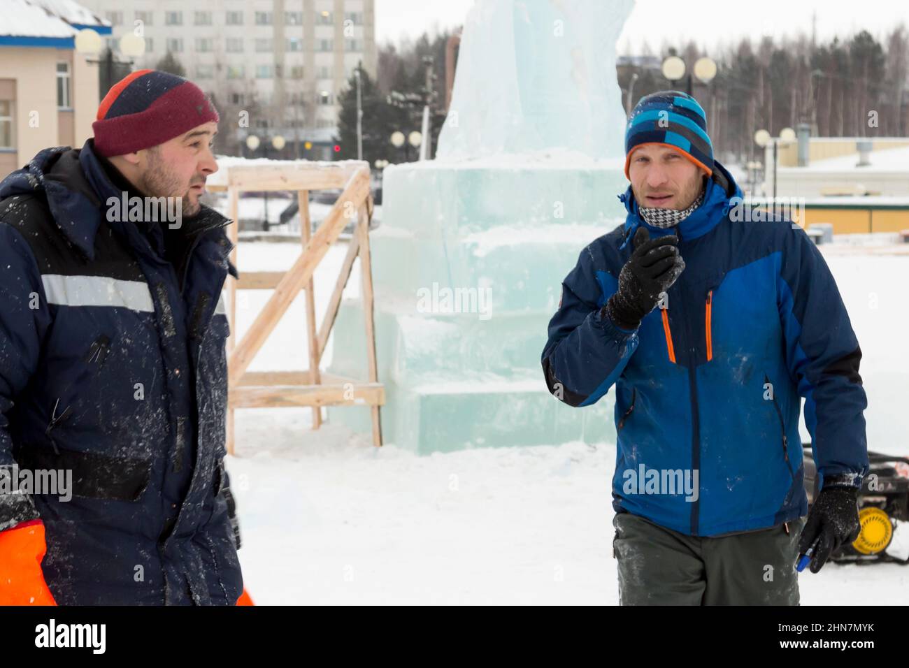 Installers at the construction site are talking Stock Photo