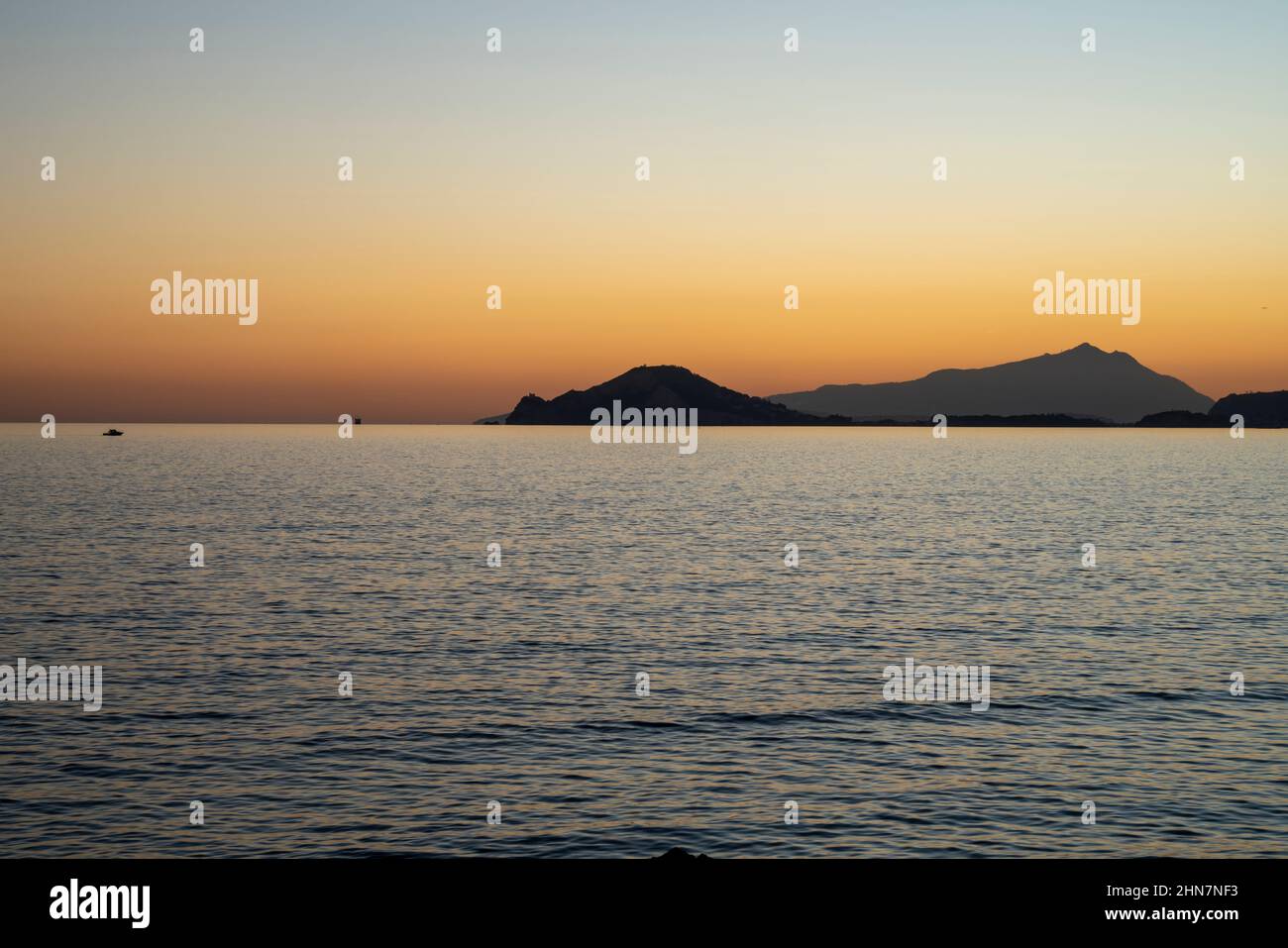 Sunset at sea. Sea landscape. Variety of colors and hues of the sun. Bagnoli, Naples, Italy. Stock Photo