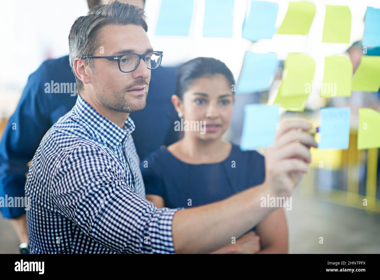 Sharing his thoughts. Cropped shot of a handsome businessman making ...