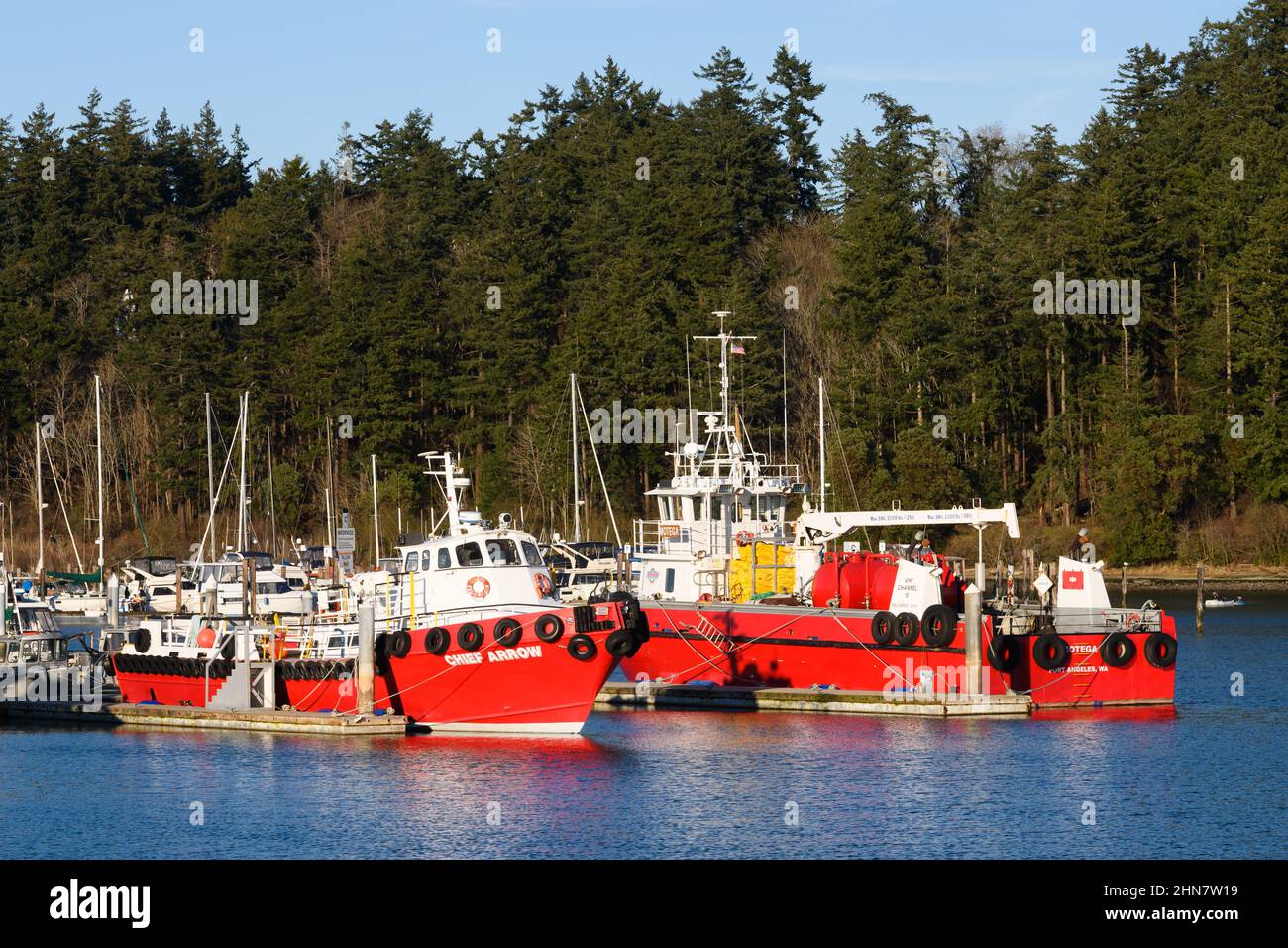 Anacortes, WA, USA - February 12, 2022; Red vessels of Arrow Launch Services at Cap Santa Marina in Anacortes.  The boats are Chief Arrow and Montega Stock Photo