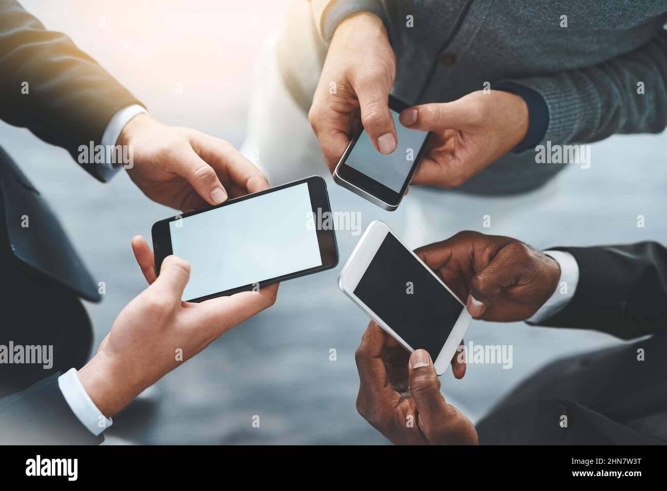 Business is better when youre connected. High angle shot of a group of ...