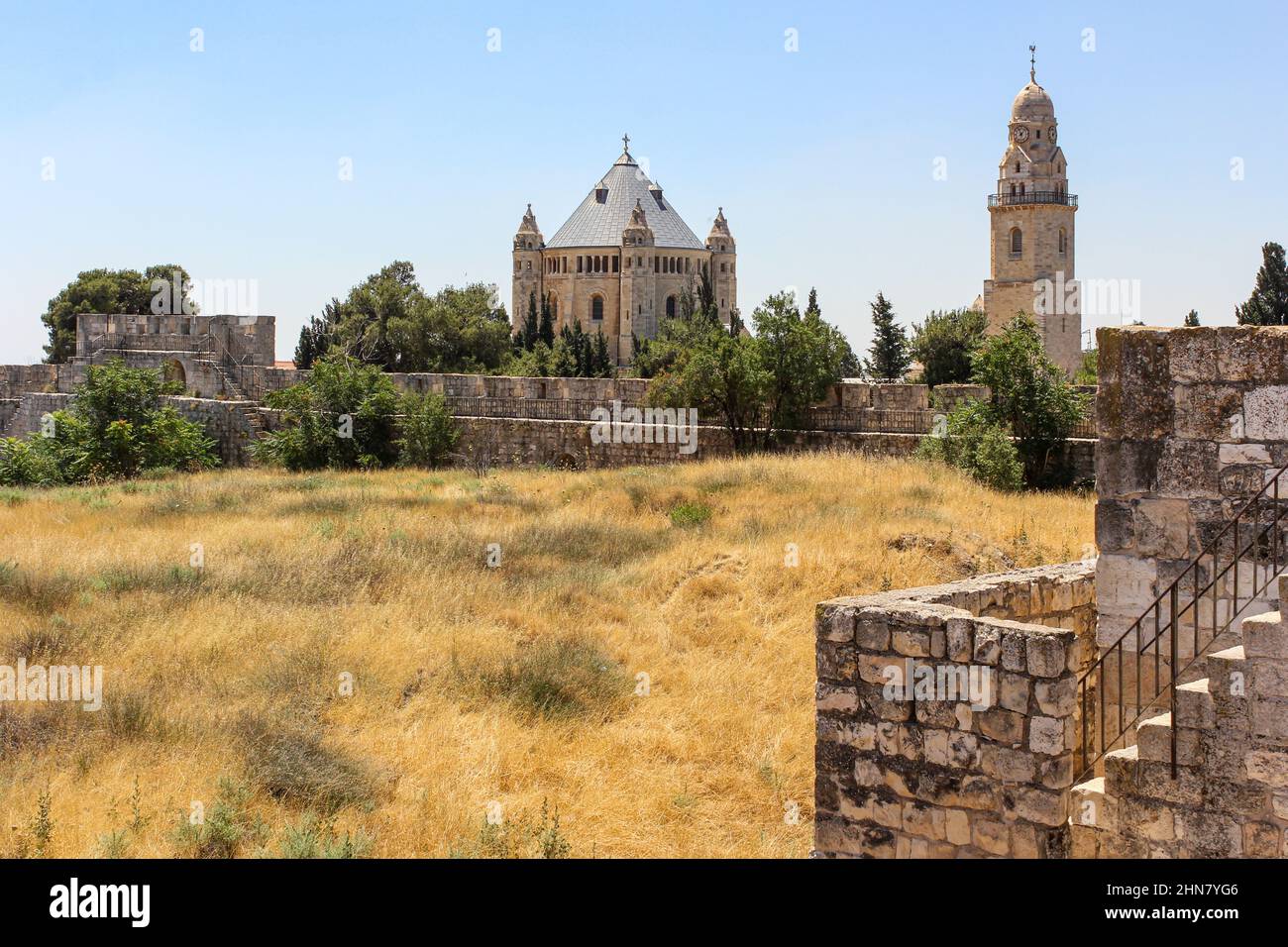 The Basilica of the Assumption and its bell tower stand within the overgrown walls of the Abbey of the Dormition in Jerusalem, Israel. Stock Photo