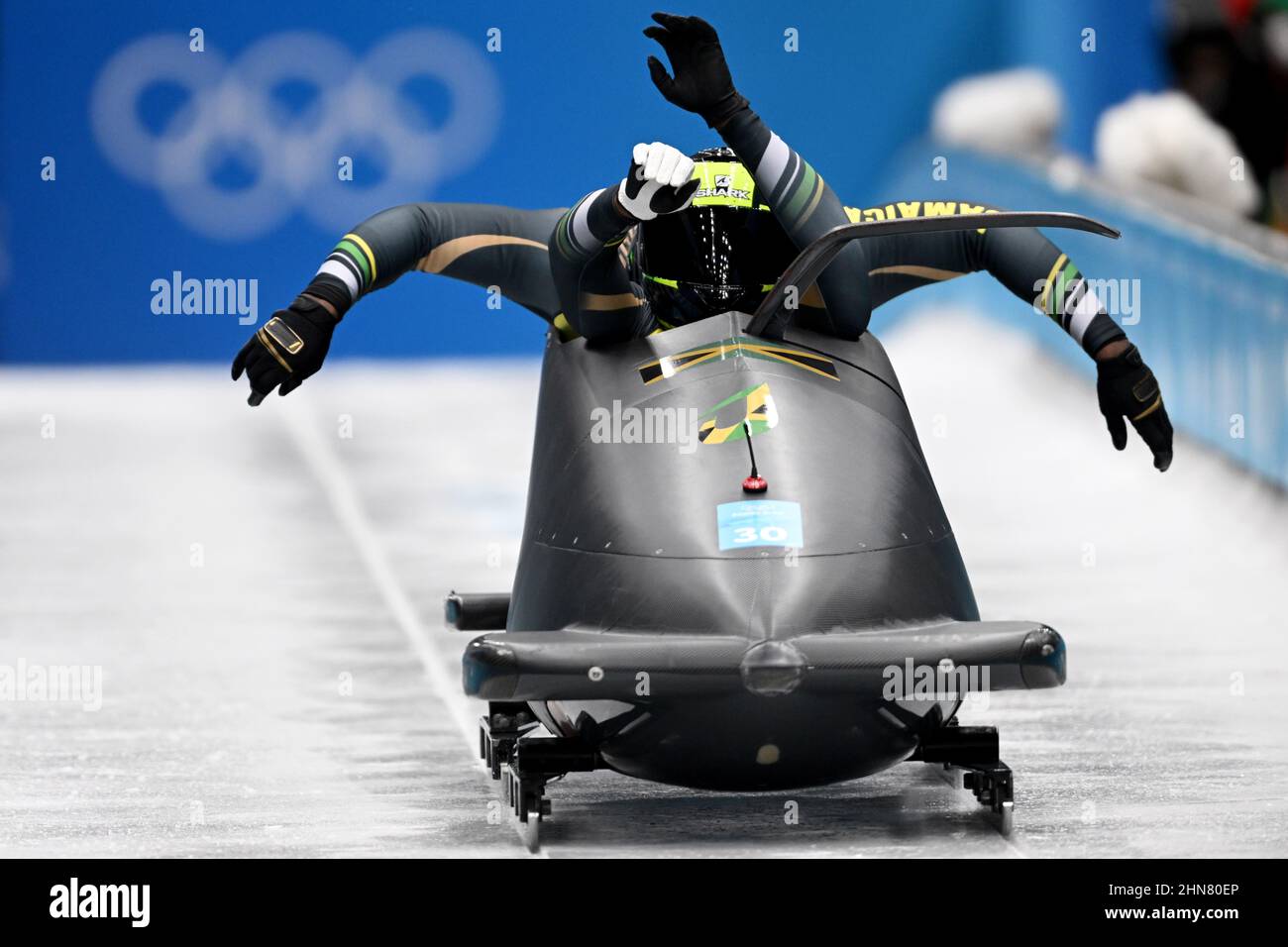 Yanqing, China. 14th Feb, 2022. Olympics, bobsleigh, two-man bobsleigh, men, 1st run at the National Sliding Centre, bobsleigh pilot Shanwayne Stephens (front) and his pusher Nimroy Turgott of Jamaica start. Credit: Robert Michael/dpa-Zentralbild/dpa/17�Թ����� Live News Stock Photo