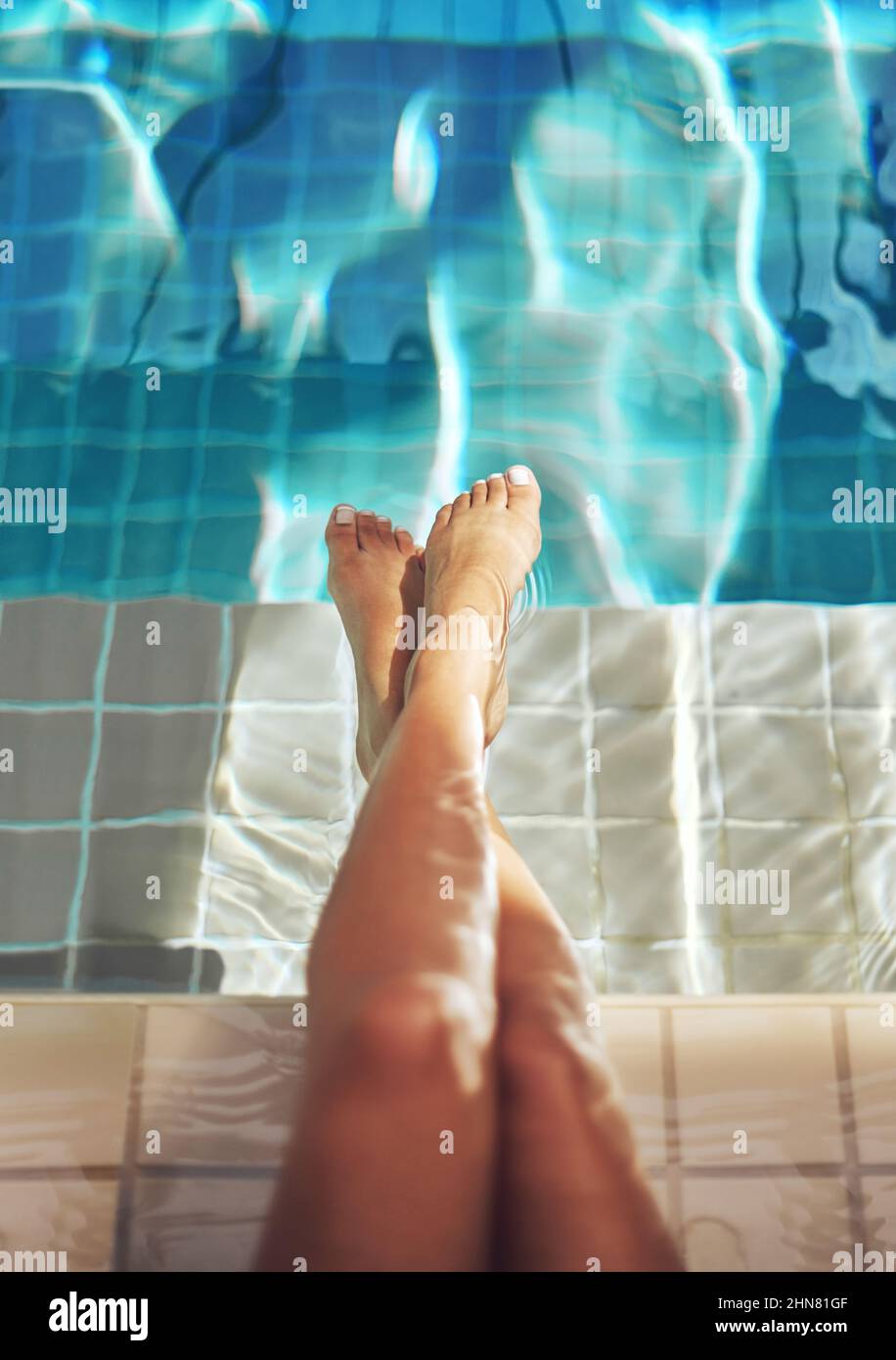 Luxurious legs. Cropped shot of a womans feet in the water of a spa