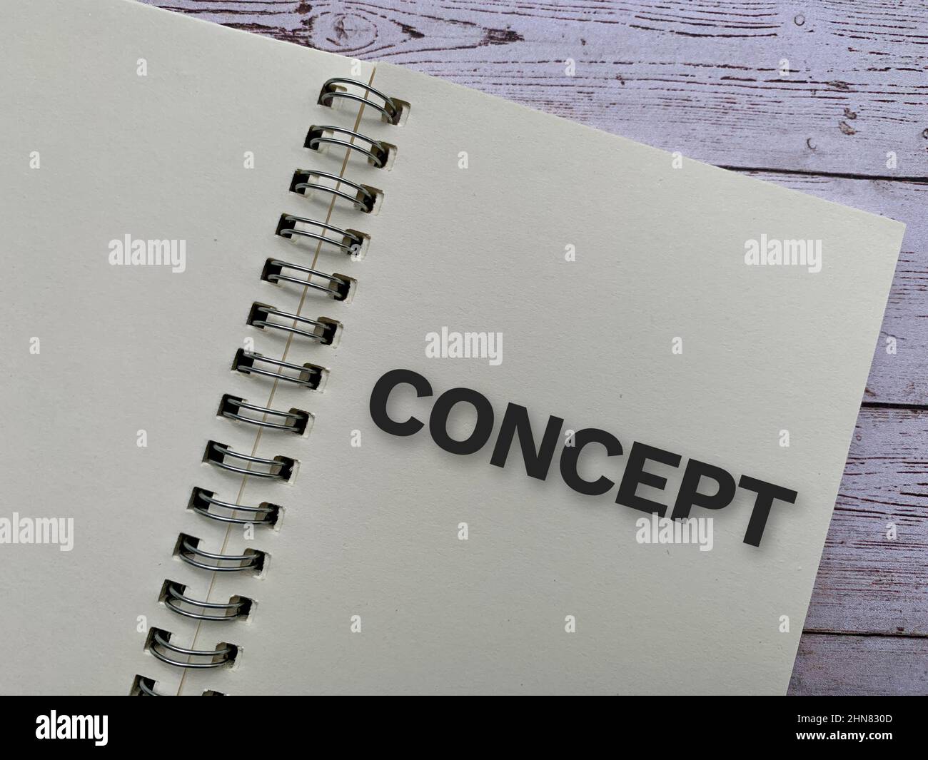 Top view of text on notepad - Concept with wooden desk background. Business concept. Stock Photo