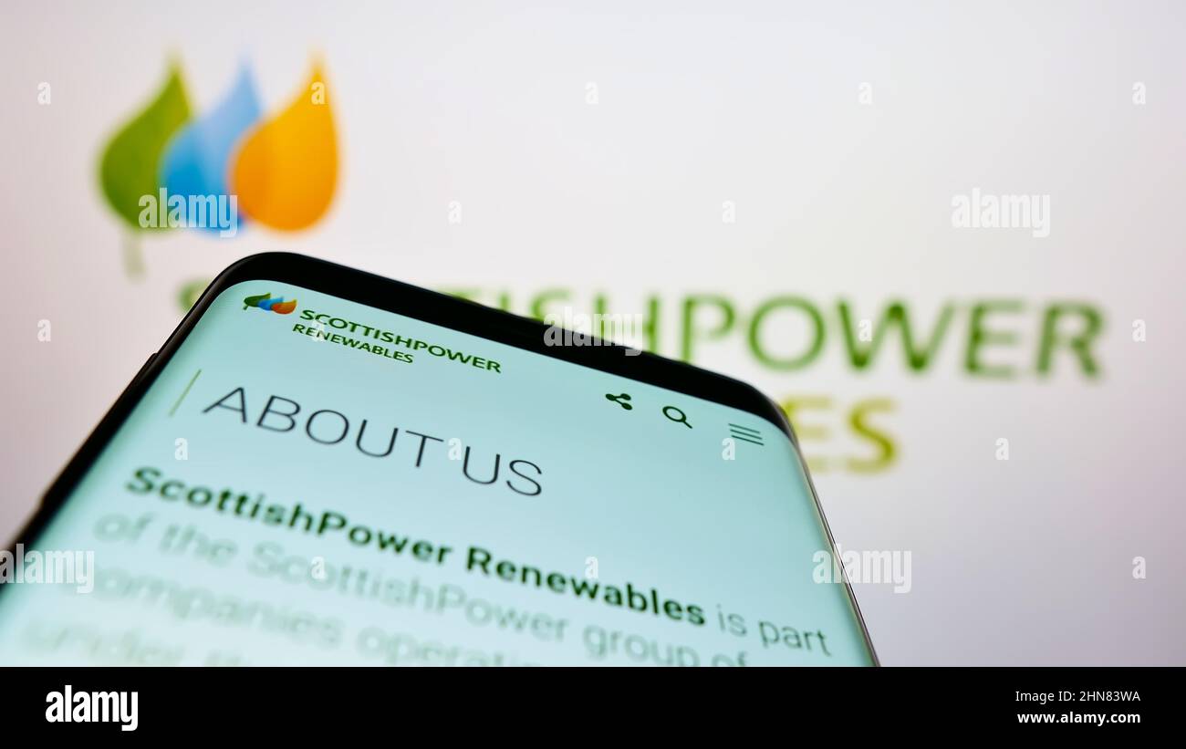 Mobile phone with website of company ScottishPower Renewables (UK) Limited on screen in front of logo. Focus on top-left of phone display. Stock Photo